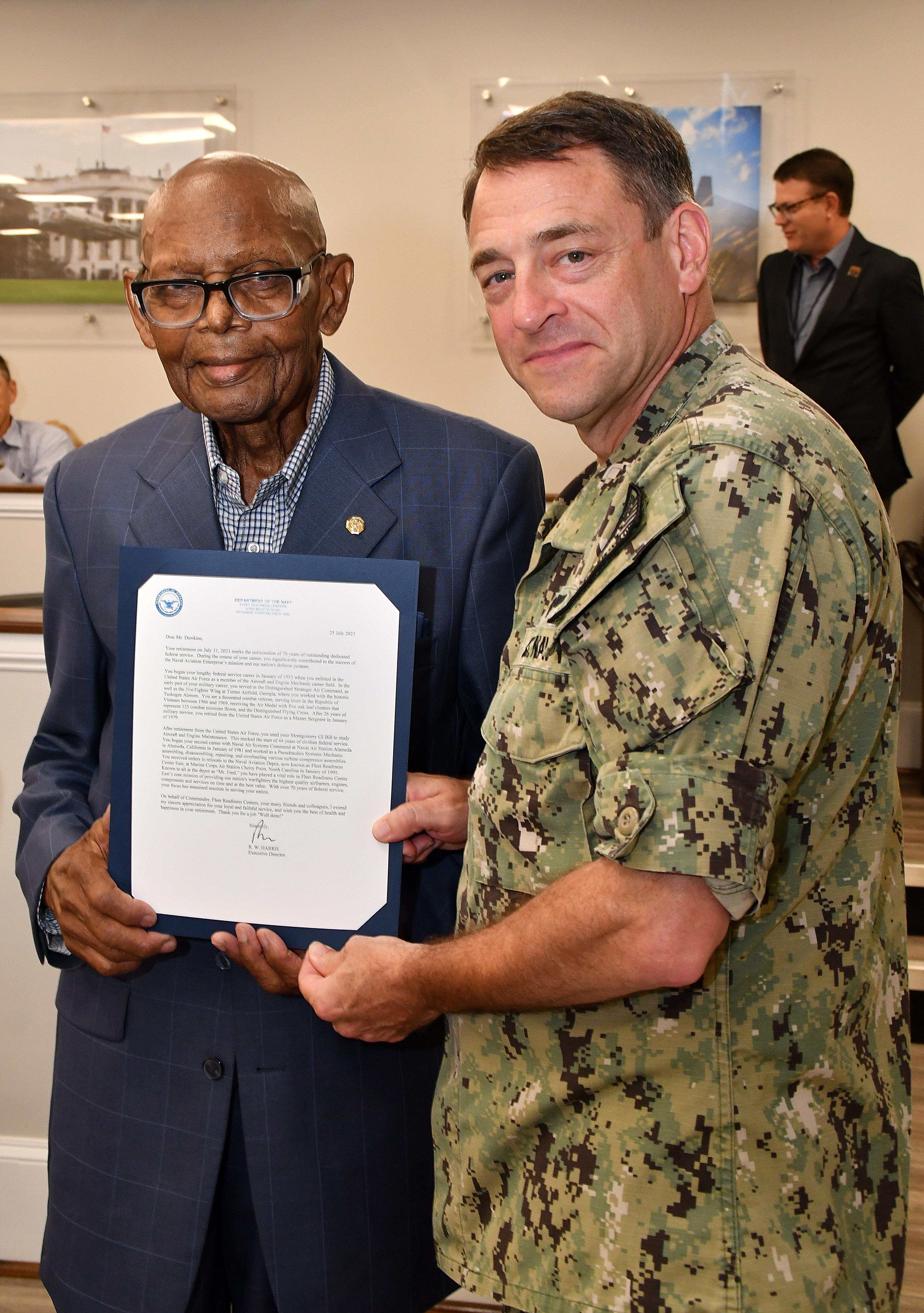 Fleet Readiness Center East (FRCE) Commanding Officer Capt. James M. Belmont recognized Freddie Dawkins, a pneudraulics systems mechanic at the depot, during a retirement ceremony honoring Dawkins’ 70 years of combined military and civilian service. 