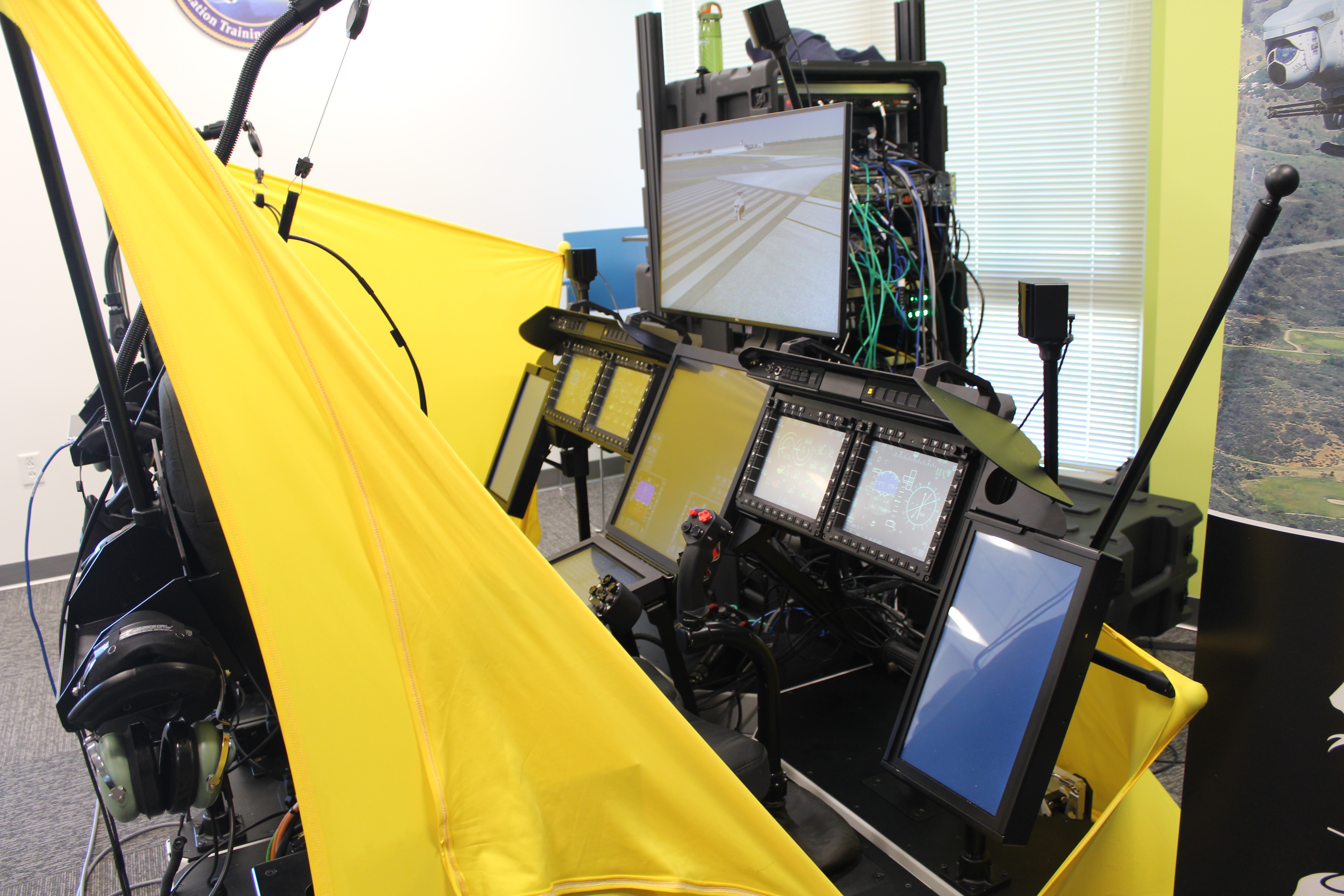 The H-1 Mission Rehearsal Trainer (MRT) on display during a March 14 demonstration at NAVAIR headquarters. The new simulator provides on-site mission rehearsal training, increasing opportunities for pilots to maintain combat skills while deployed. (U.S. Navy Photo)