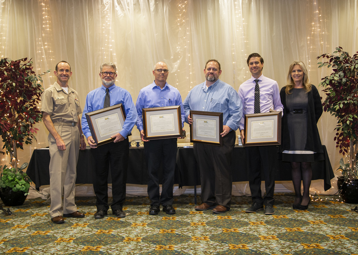 Winners of the Michelson Laboratory Award accept their certificates from Rear Adm. Scott Dillon, NAWCWD commander, and Joan Johnson, NAWCWD executive director, during the 2019 Honorary Awards Ceremony at China Lake on June 25. (U.S. Navy photo by Ryan Smith)