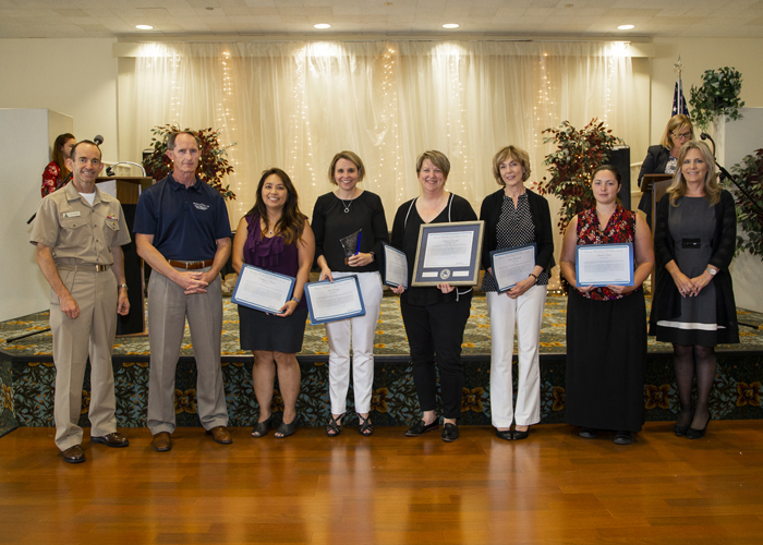 Winners of the Business Management Excellence Team Award, Let’s Go Team, accept their certificates from Rear Adm. Scott Dillon, NAWCWD commander, and Joan Johnson, NAWCWD executive director, during the 2019 Honorary Awards Ceremony at China Lake on June 25. (U.S. Navy photo by Ryan Smith)