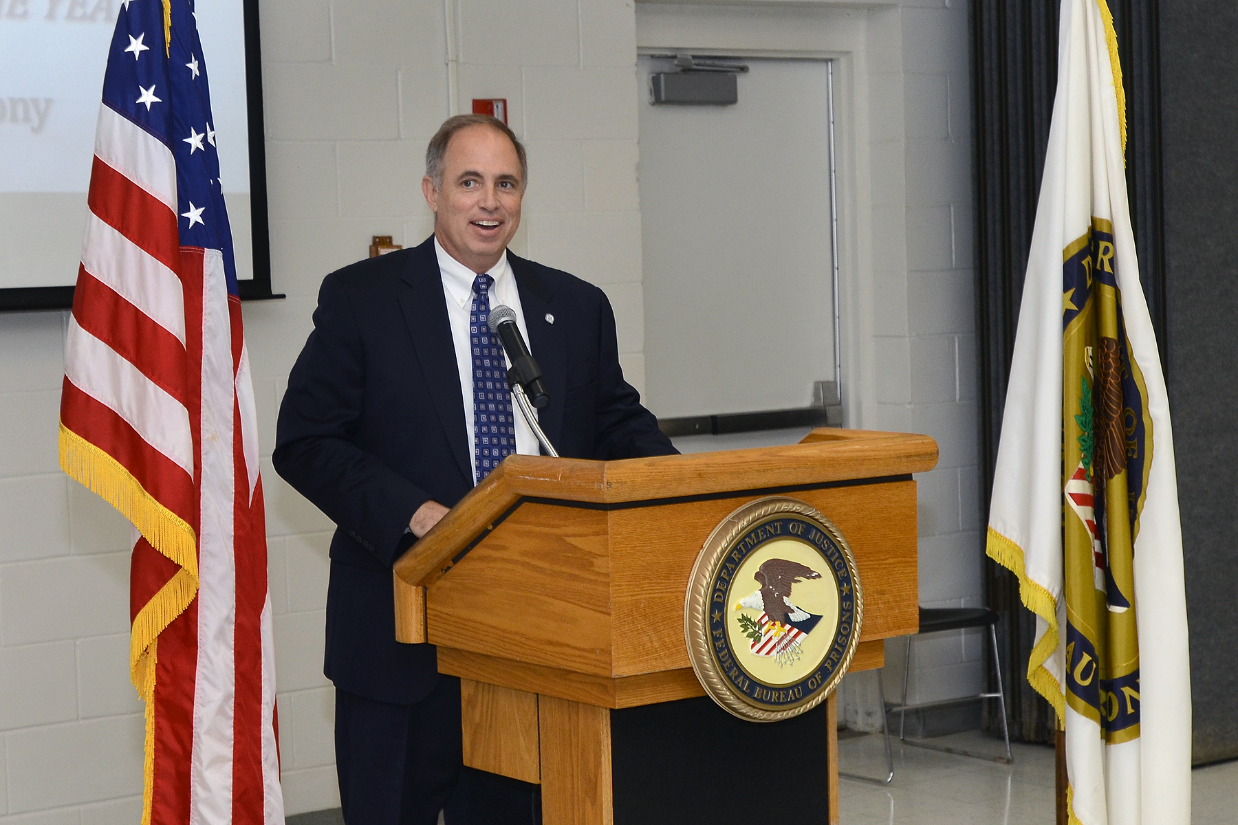 John J. Daly, President of the Central Florida Federal Executive Association and Naval Air Warfare Center Training Systems Division Director of Corporate Operations welcomes attendees to the association's first-ever Federal Employee of the Year Awards Ceremony at the Federal Correctional Complex - Coleman. The awards ceremony held during Public Service Recognition Week honored the contributions of federal employees throughout Central Florida.  