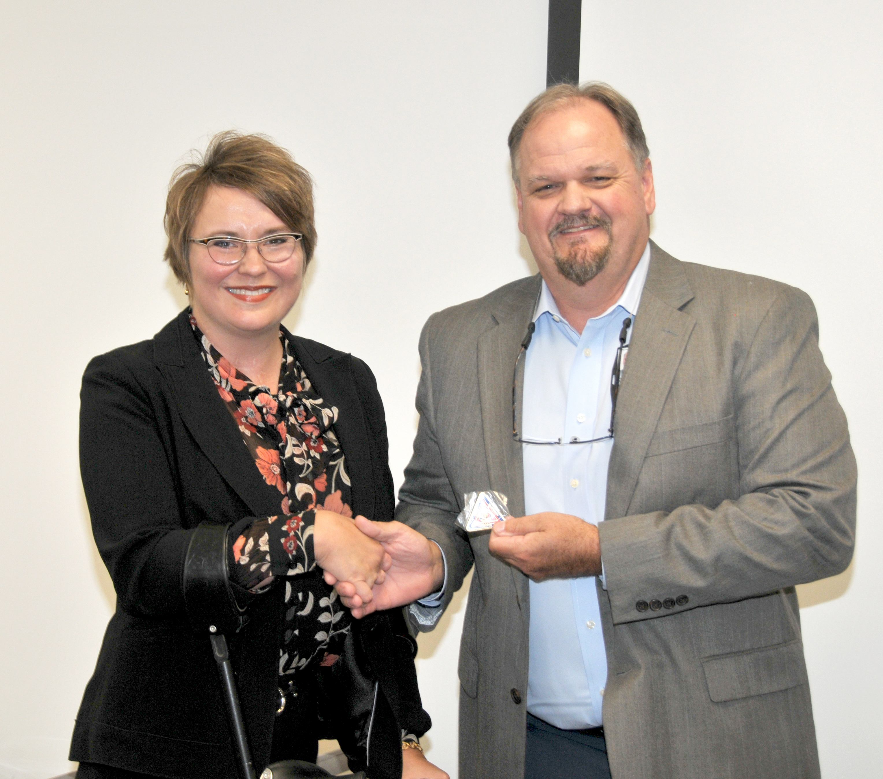 Deborah Moy receives FRCE coin  