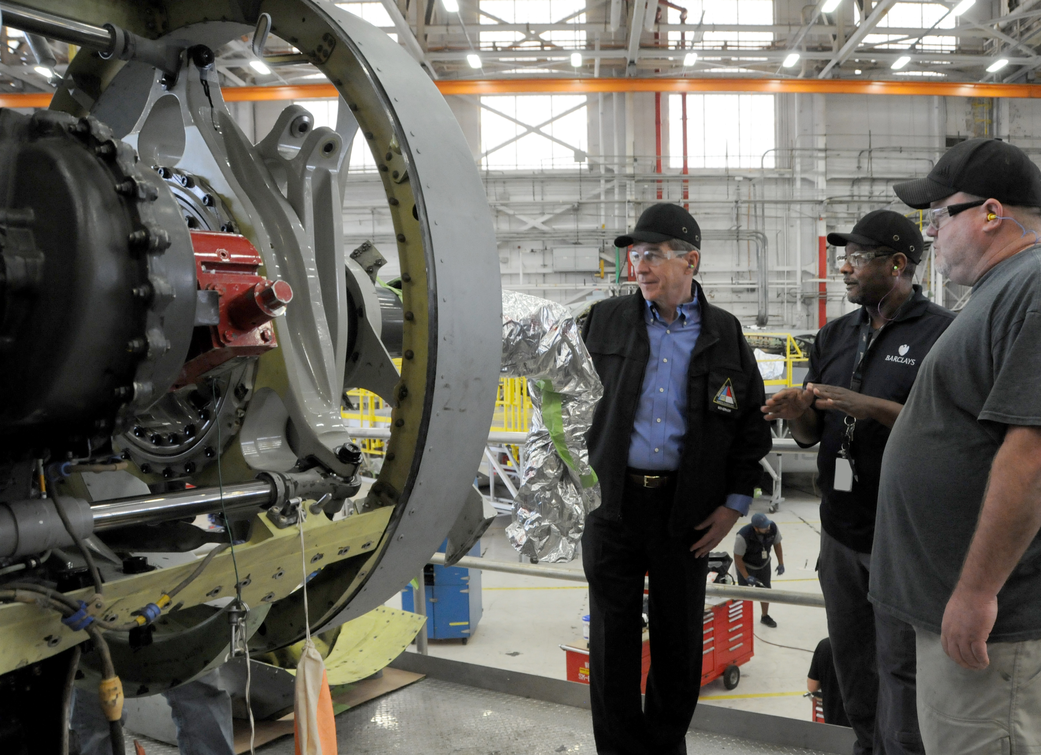 North Carolina Governor Roy Cooper views a V-22 nacelle with FRCE artisans