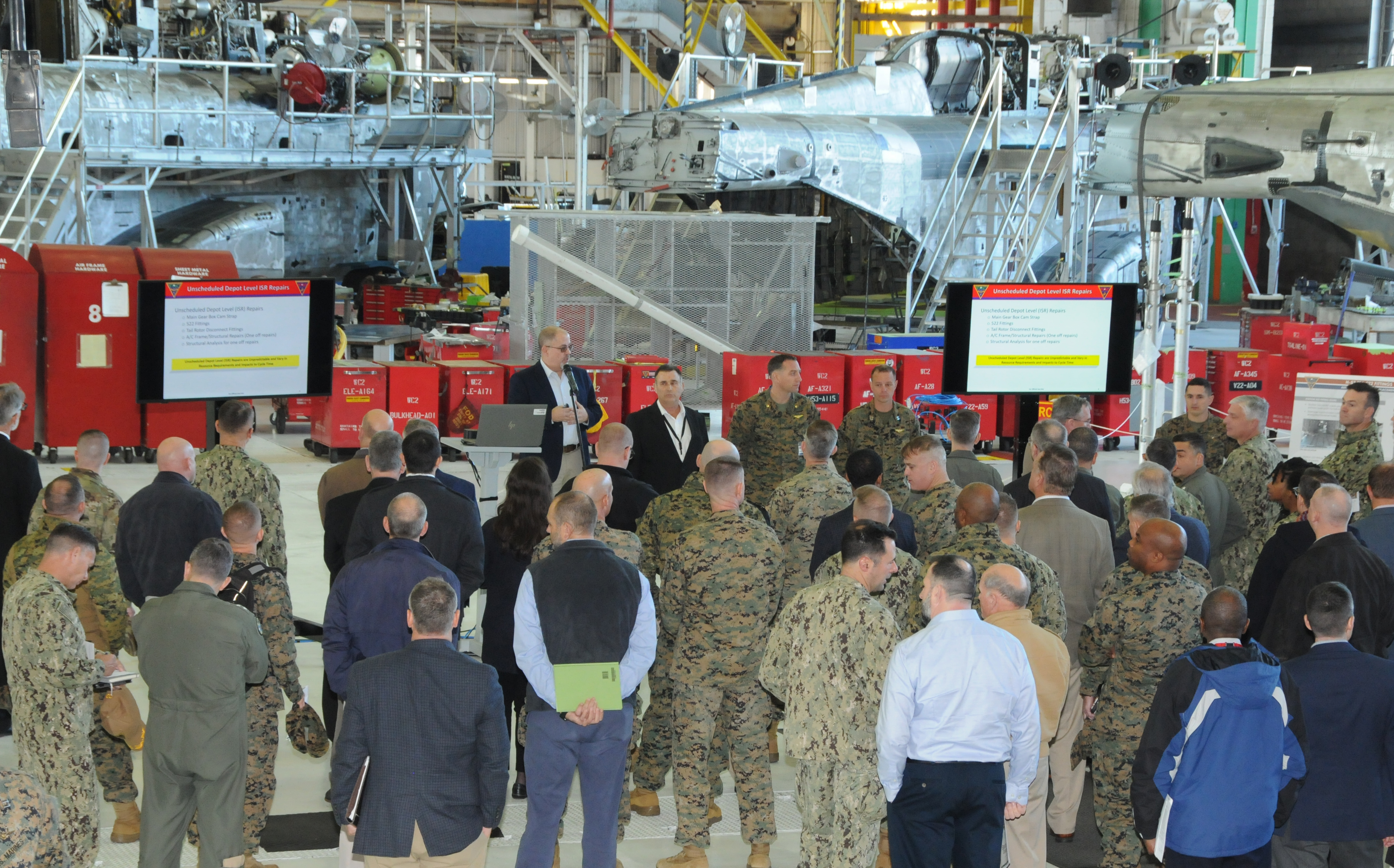 Boots on the Ground attendees in H-53 hangar