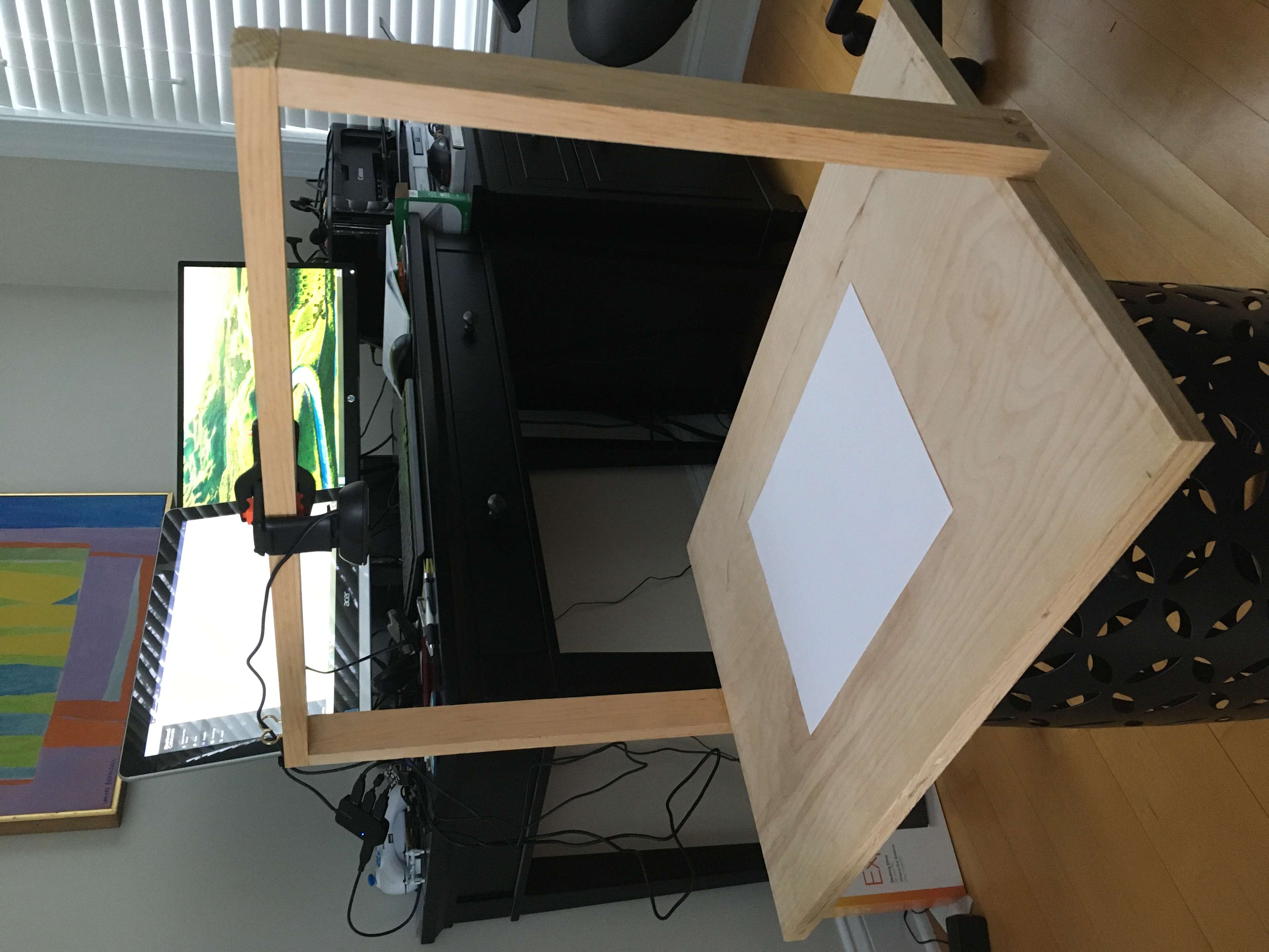 To help instruct remote students during the COVID-19 pandemic, U.S. Naval Test Pilot School instructors have rigged up ingenious alternatives to the traditional blackboard, like this overhead projection device in the home office of chief academic instructor John O'Connor.