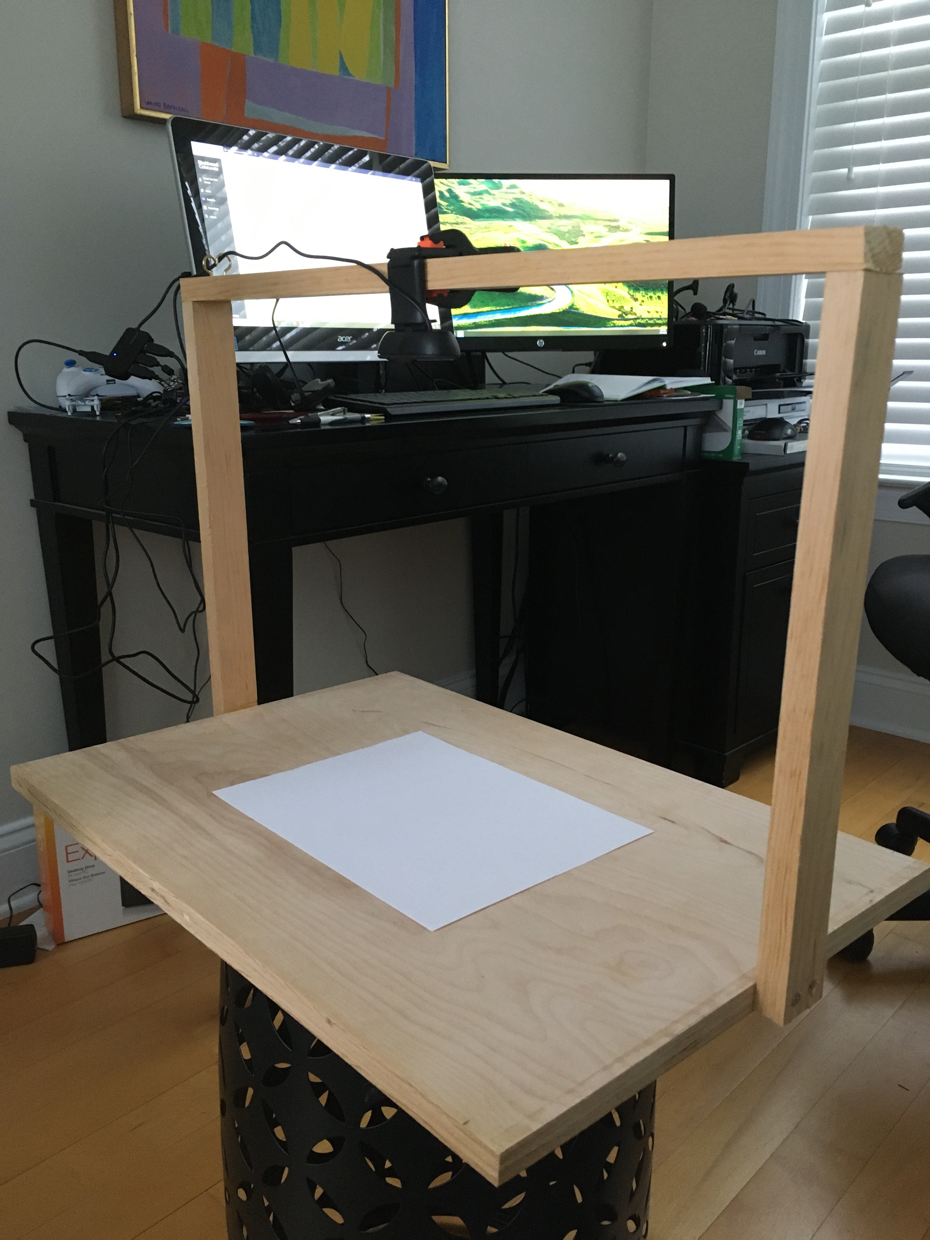 To help instruct remote students during the COVID-19 pandemic, U.S. Naval Test Pilot School instructors have rigged up ingenious alternatives to the traditional blackboard, like this overhead projection device in the home office of chief academic instructor John O'Connor.