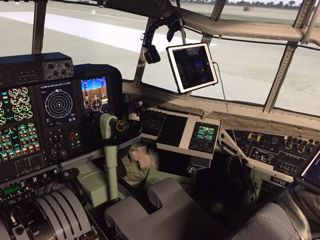 A GoPro camera installed in the cockpit of the C-130T Avionics Obsolescence Upgrade Operational Flight Trainer at Naval Air Station Fort Worth Joint Reserve Base allowed teams in four separate locations around the country to observe a software test while adhering to COVID-19 restrictions. (U.S. Navy photo by Mark J. VanMinsel)