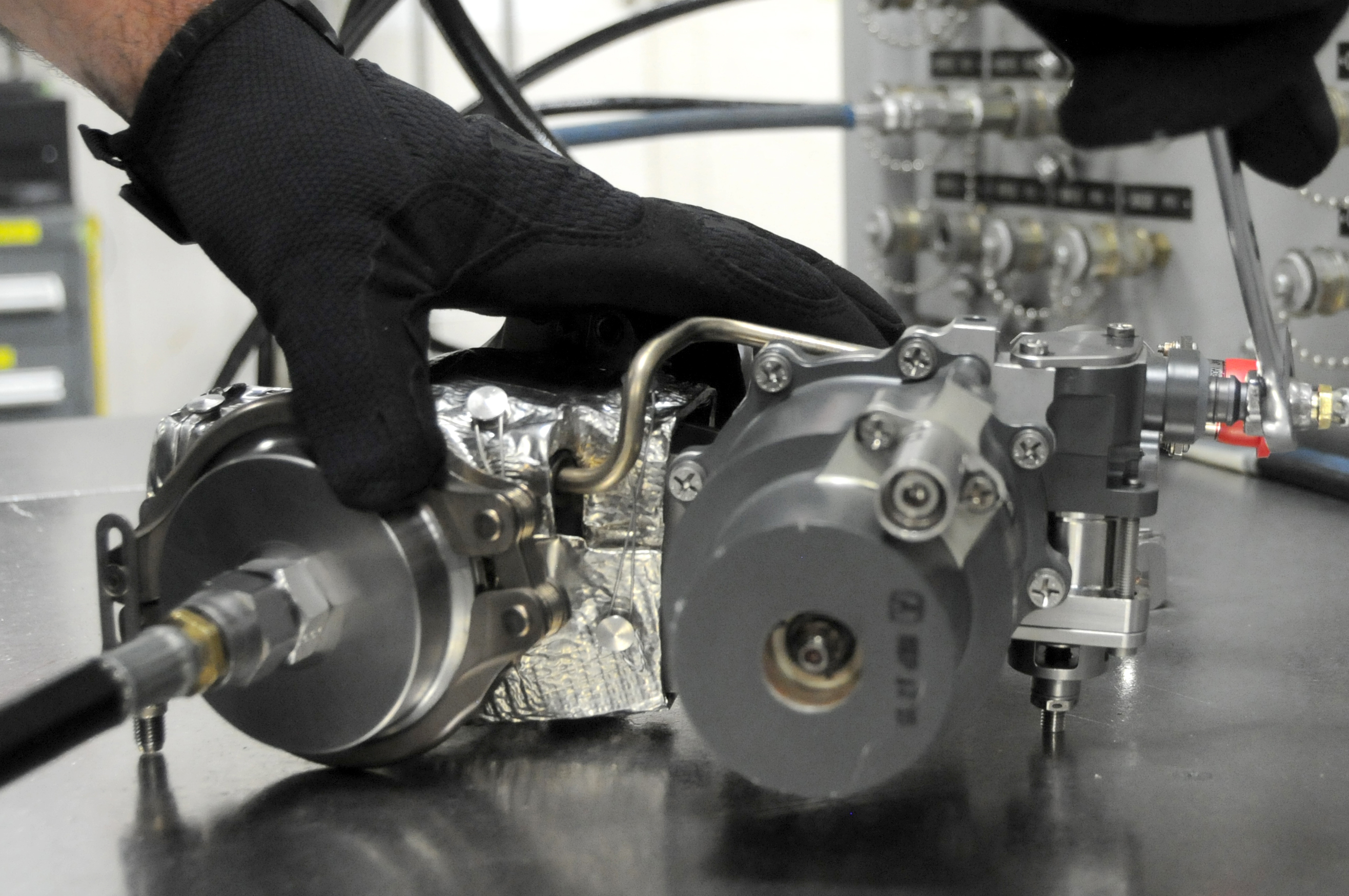 Man readies F-35 valve for testing