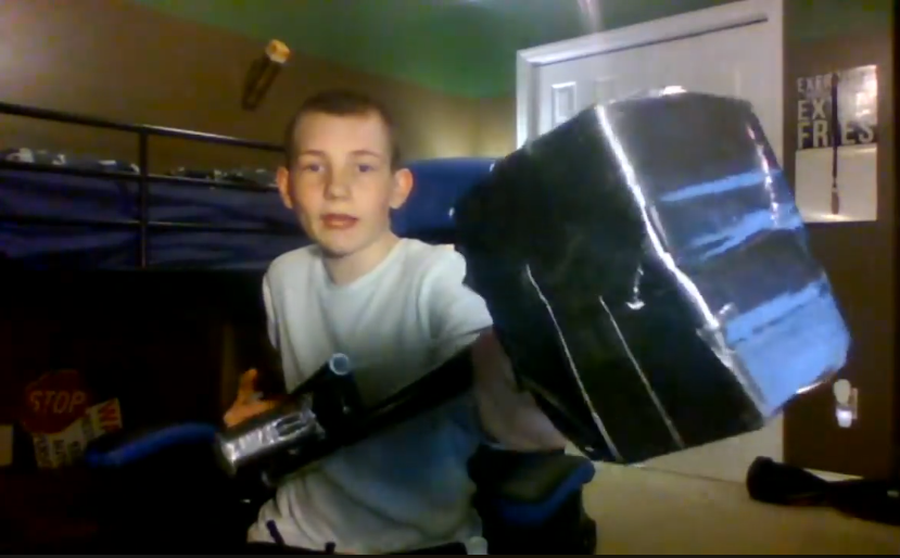 Boy displays invention he made as part of STEM educational challenge