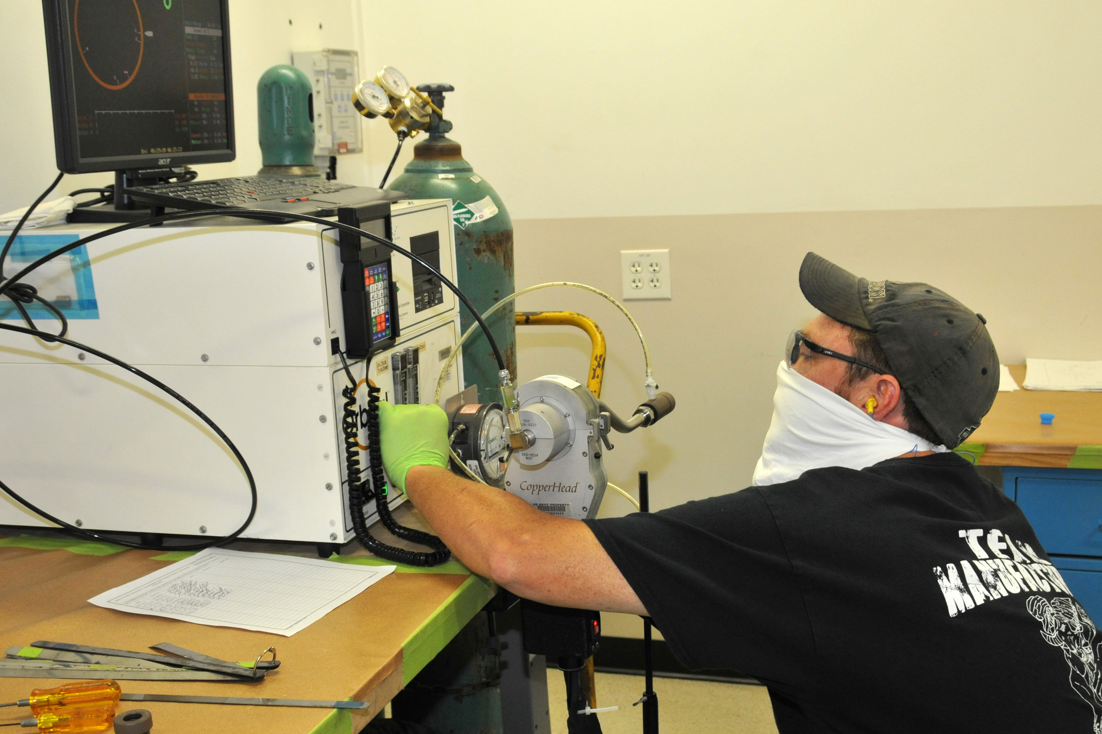 FRCE welder Robert Warmack sets up orbital welder for welding process.