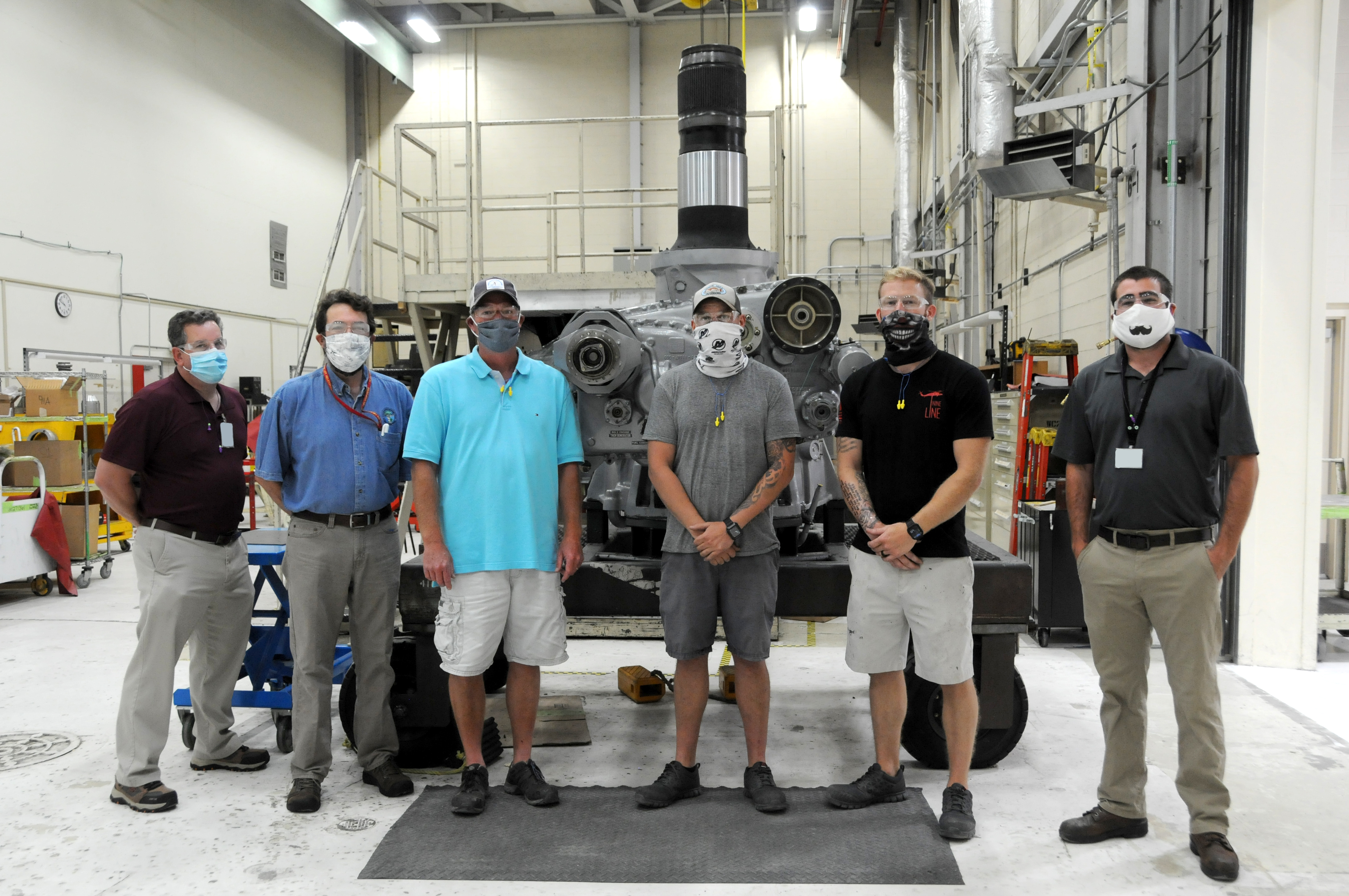 Group shot of team that facilitated helicopter repair