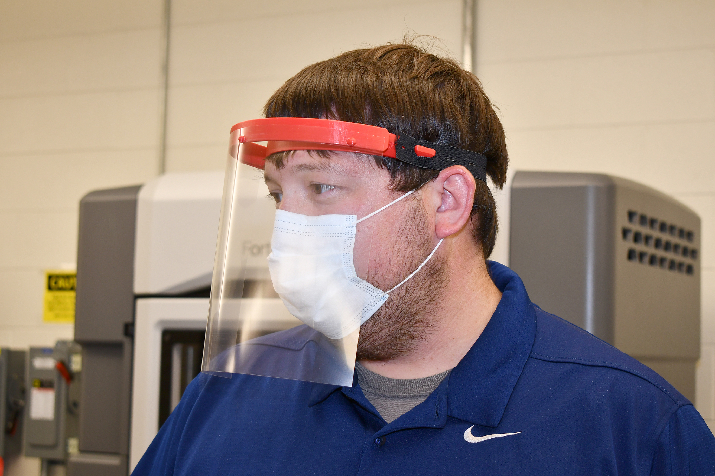 Man wears face shield