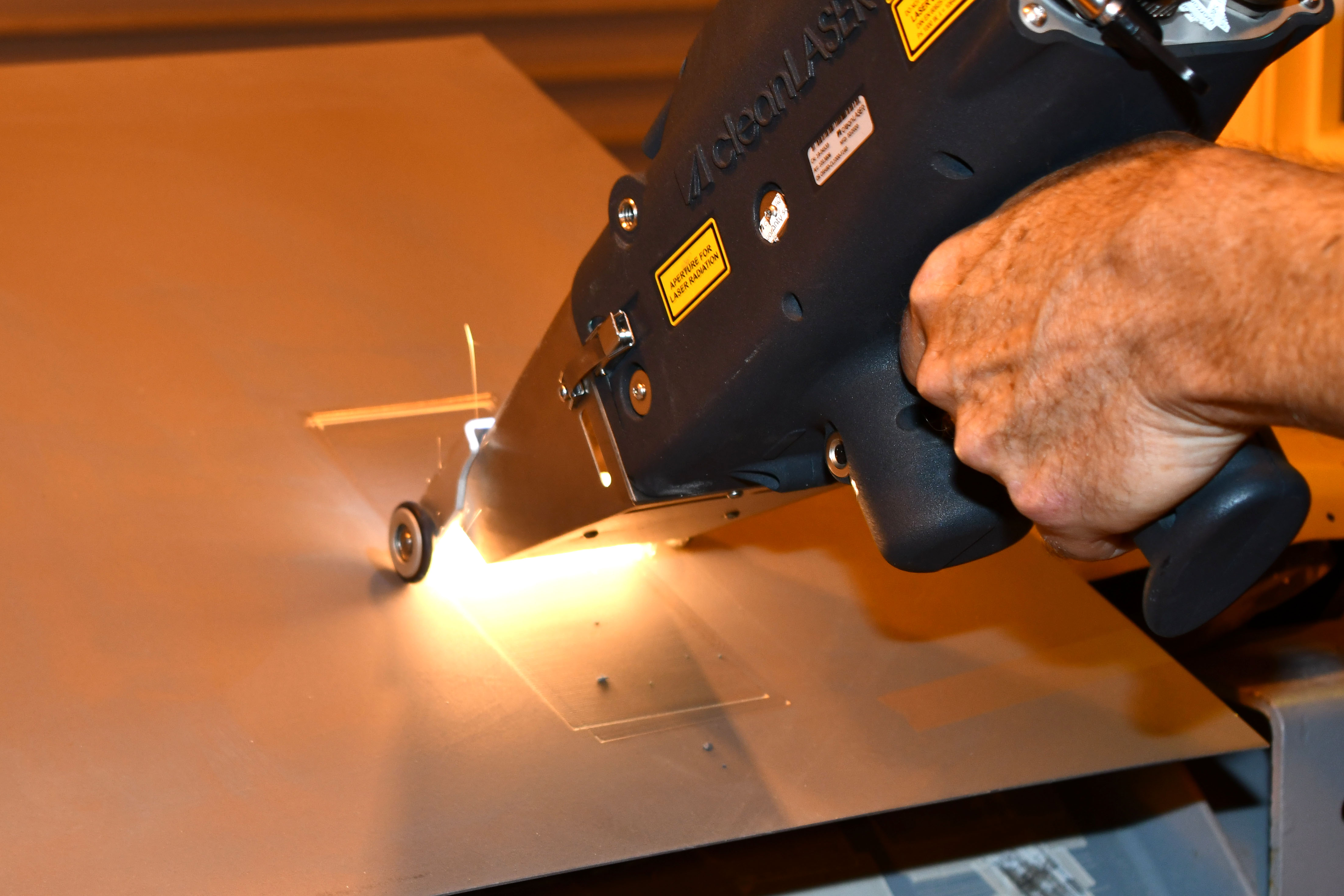 Closeup of laser stripping paint