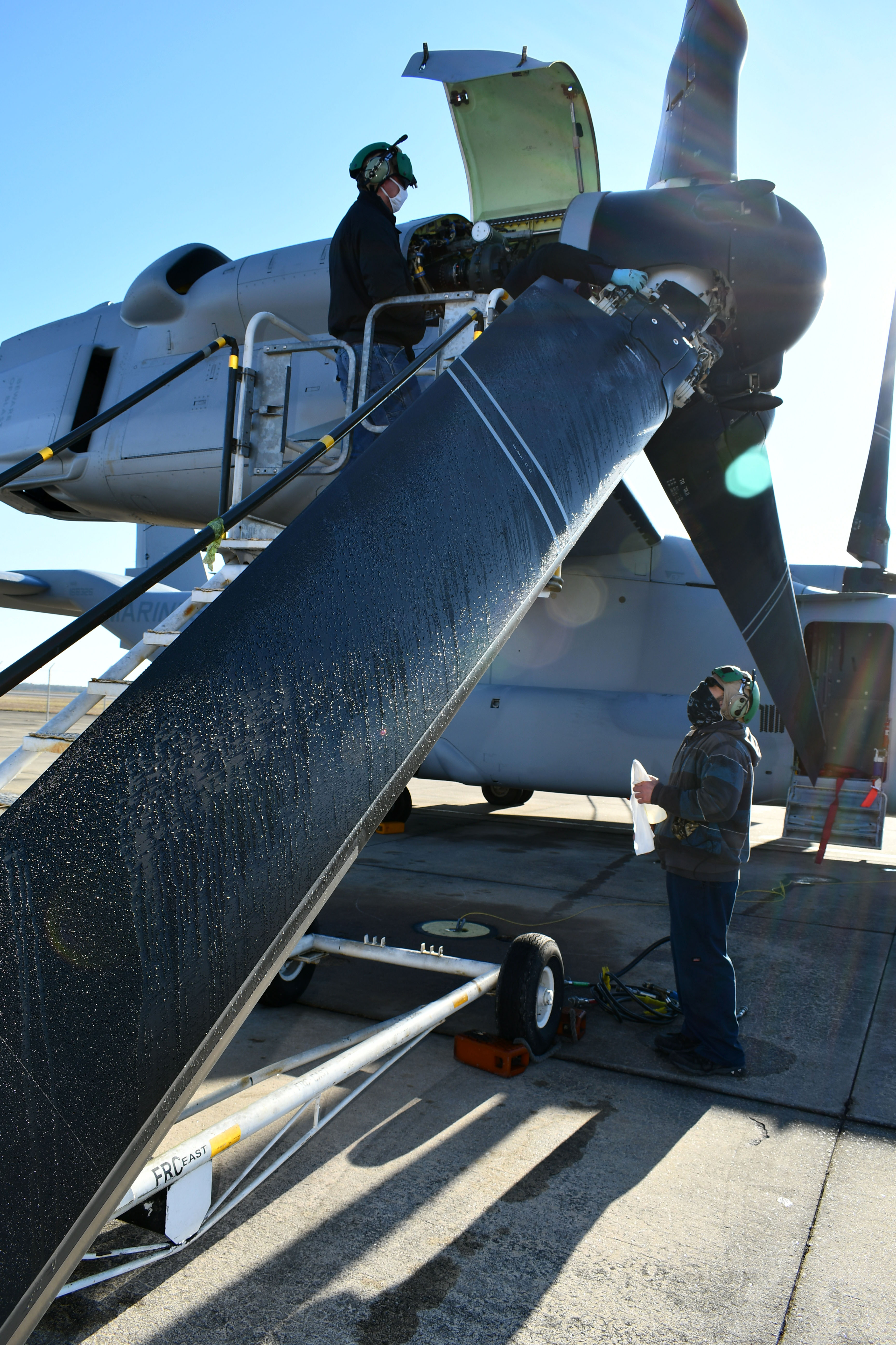 Workers inspect V-22 Osprey