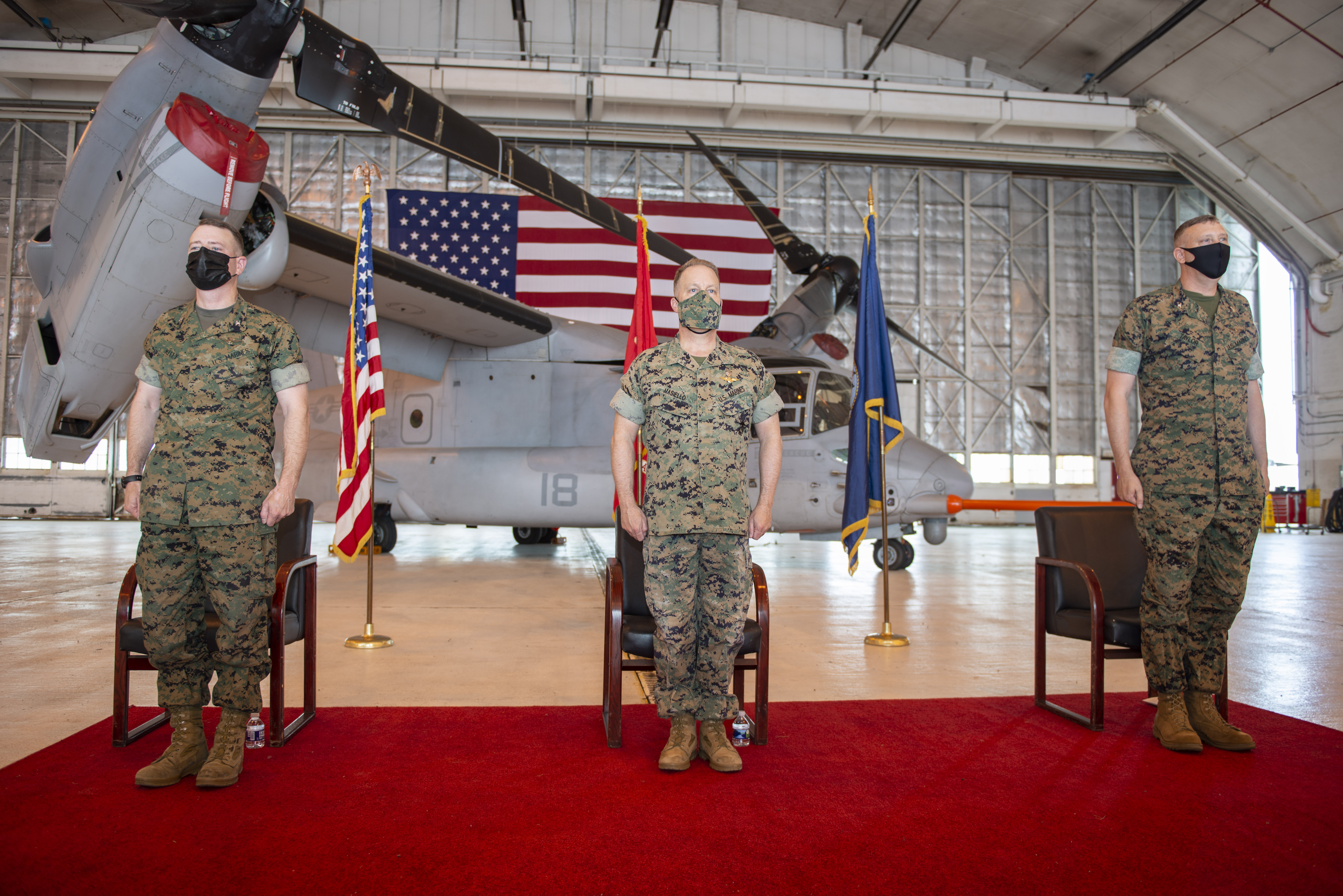 Col. Matthew Kelly, Maj. Gen. Greg Masiello, and Col. Brian Taylor stand at attention during the V-22 Joint Program Office (PMA-275) change of command ceremony Apr. 29 at Naval Air Station Patuxent River. The ceremony commemorated the transfer of duty from Col. Kelly to Col. Taylor.  