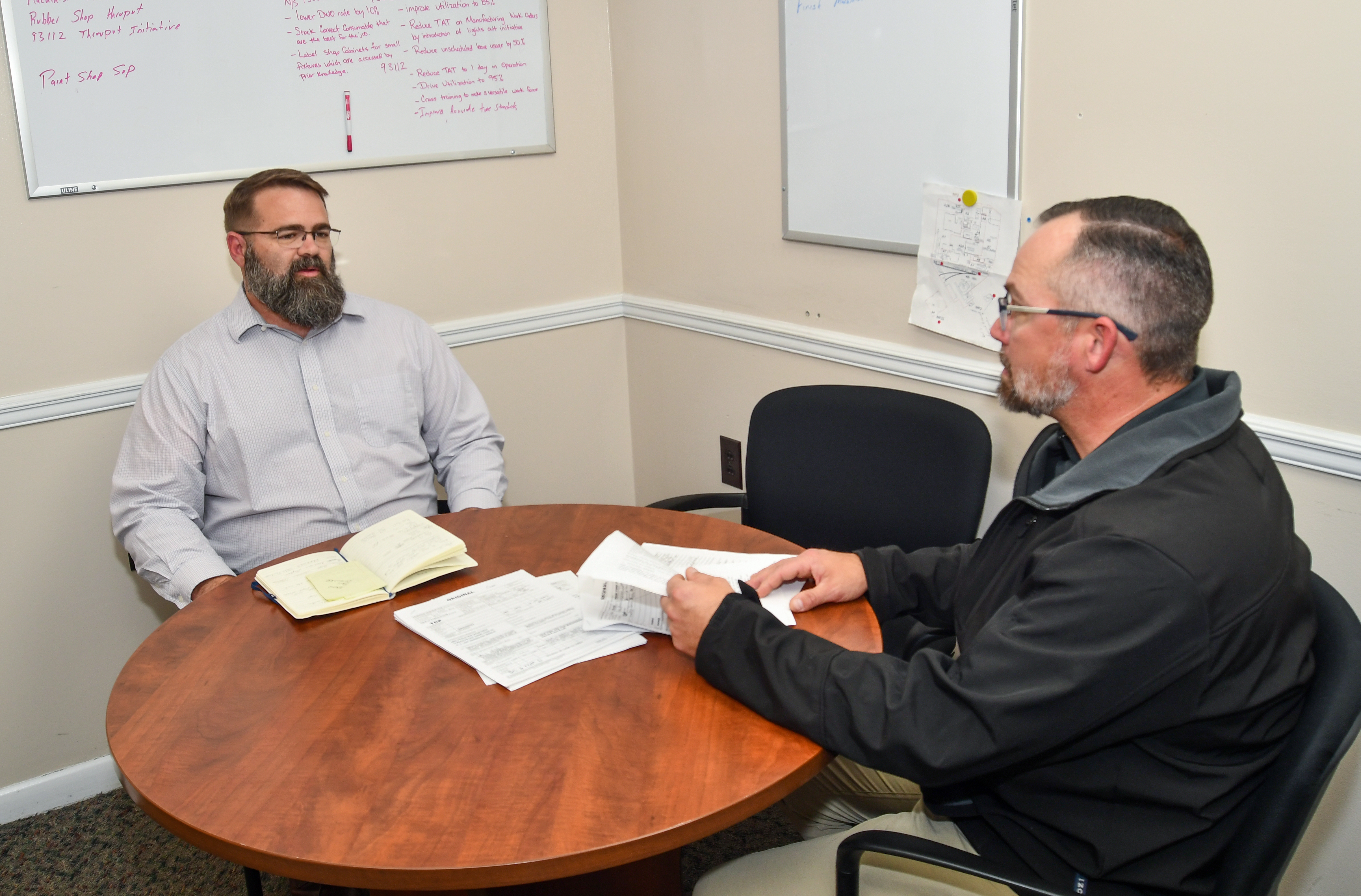 Two men sitting at a round table 
