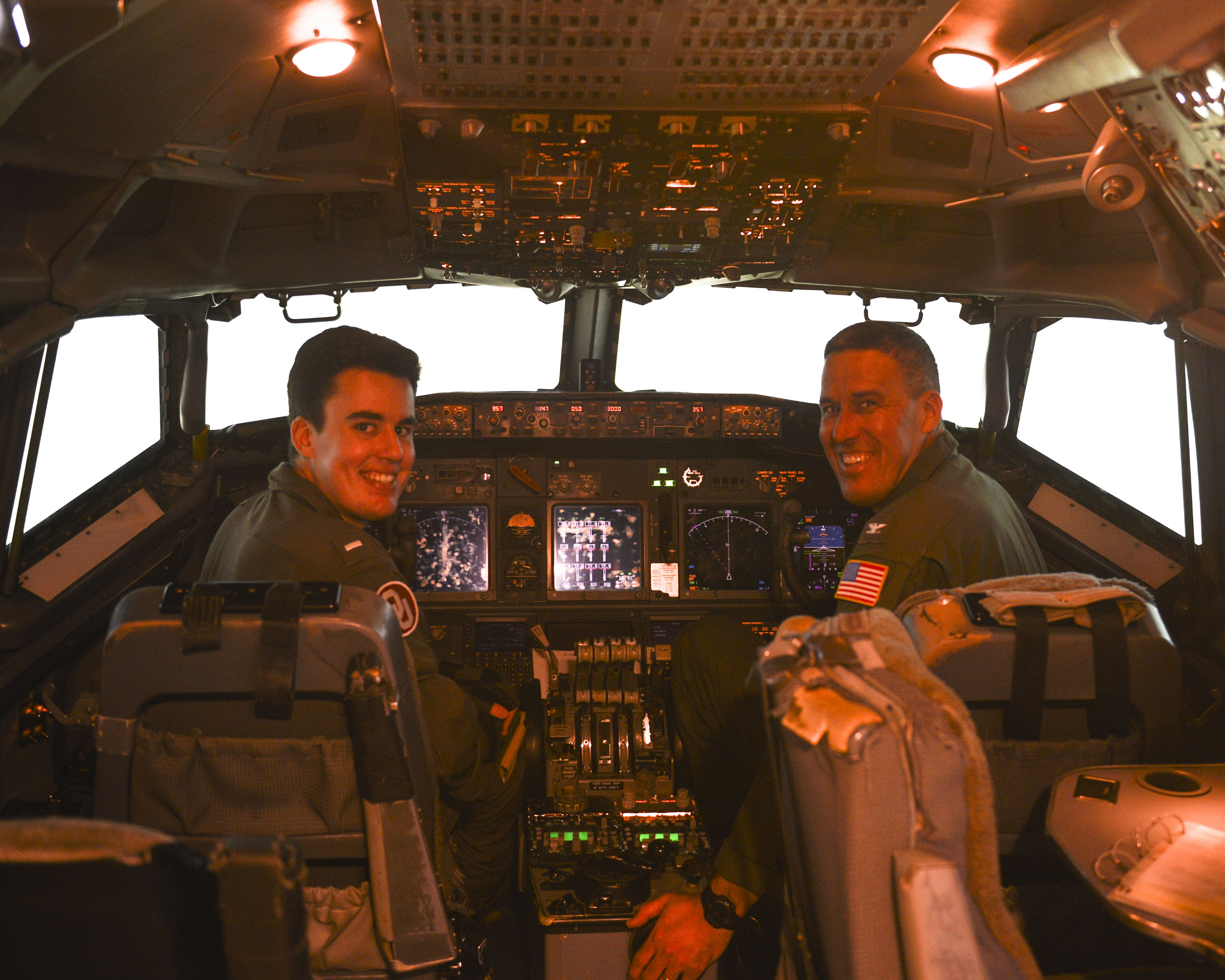 Two pilots in a cockpit trainer