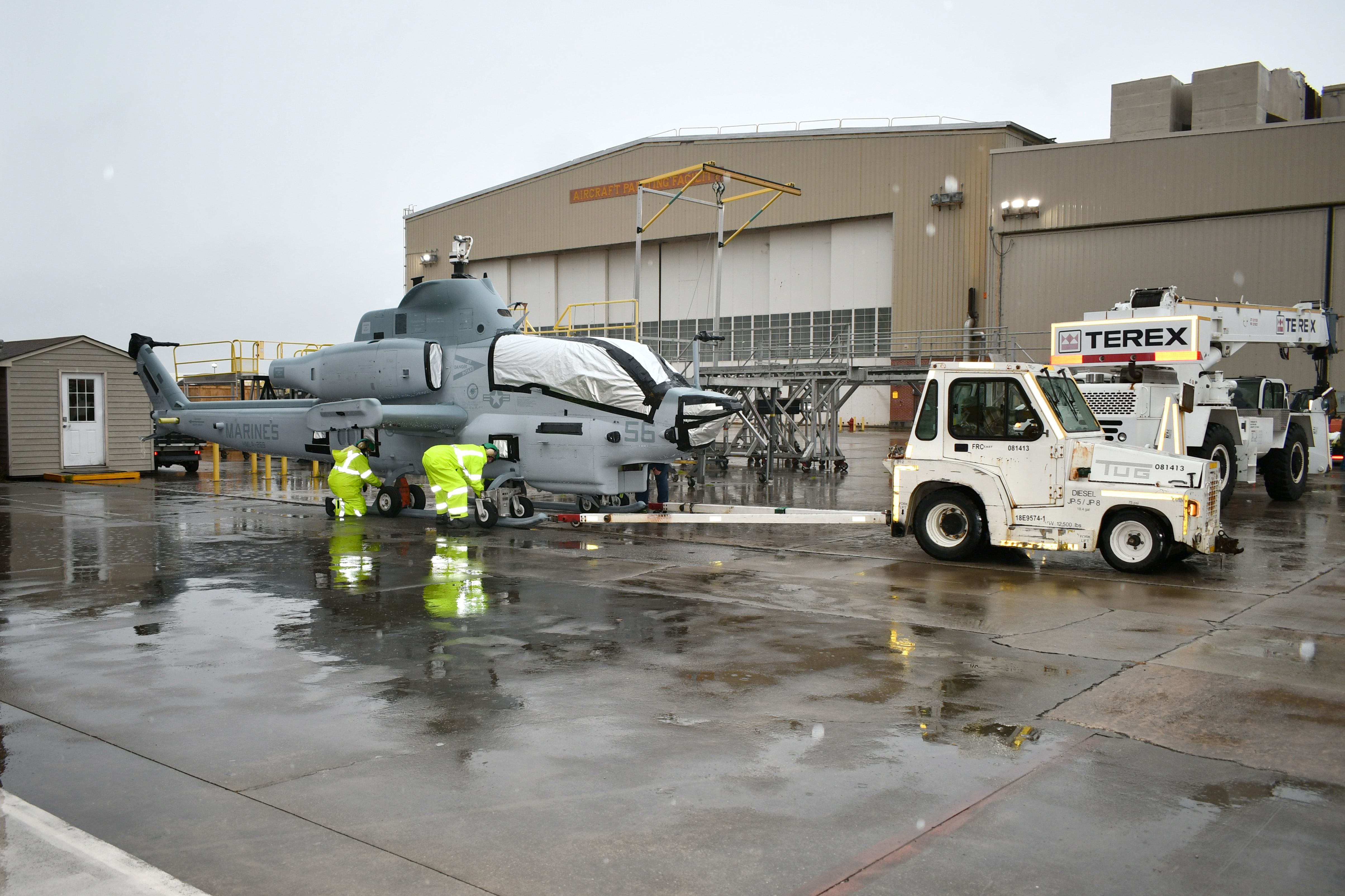 Transportation crew prepares to move H-1 aircraft
