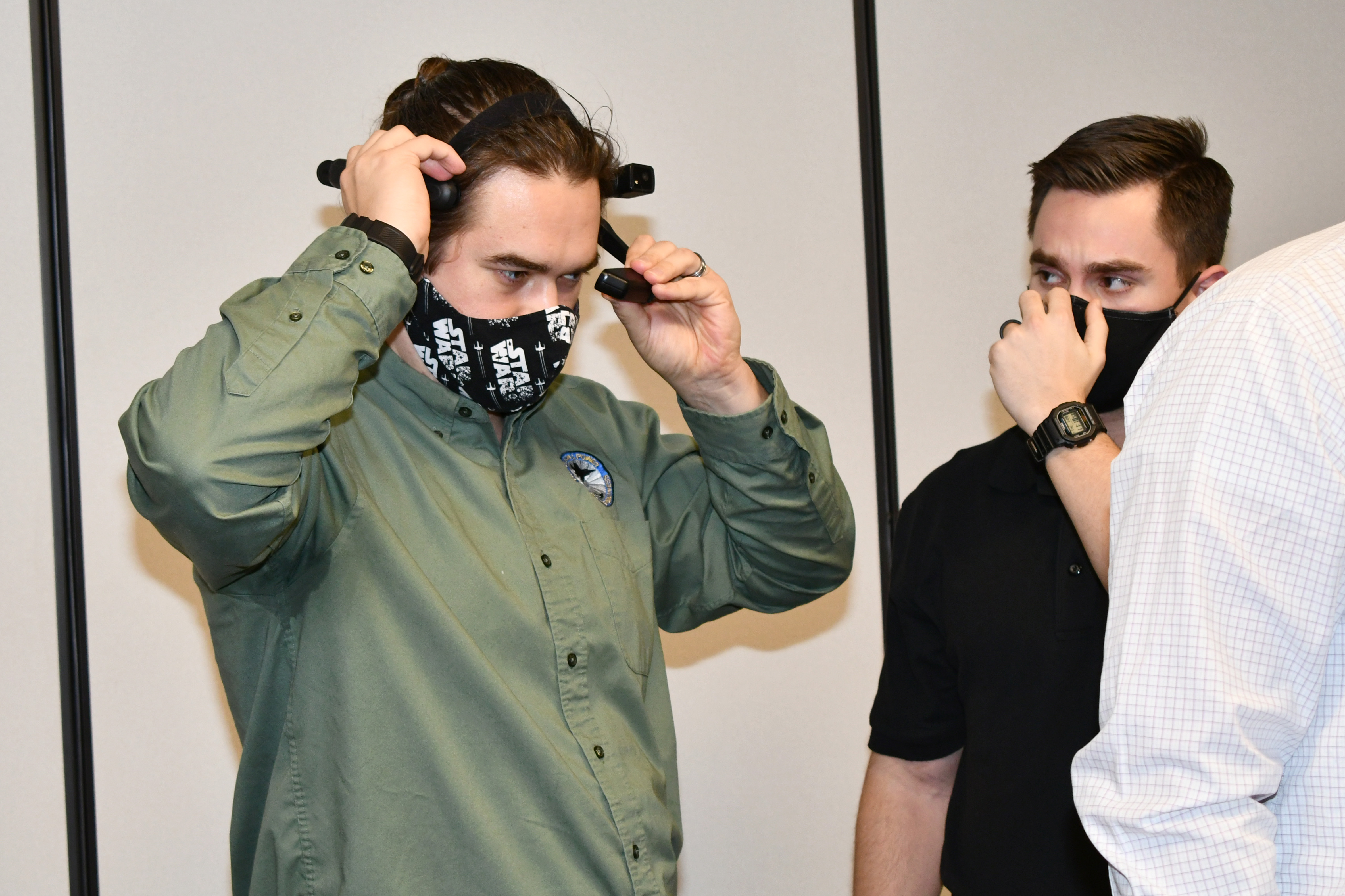 Engineer tries on augmented reality headset
