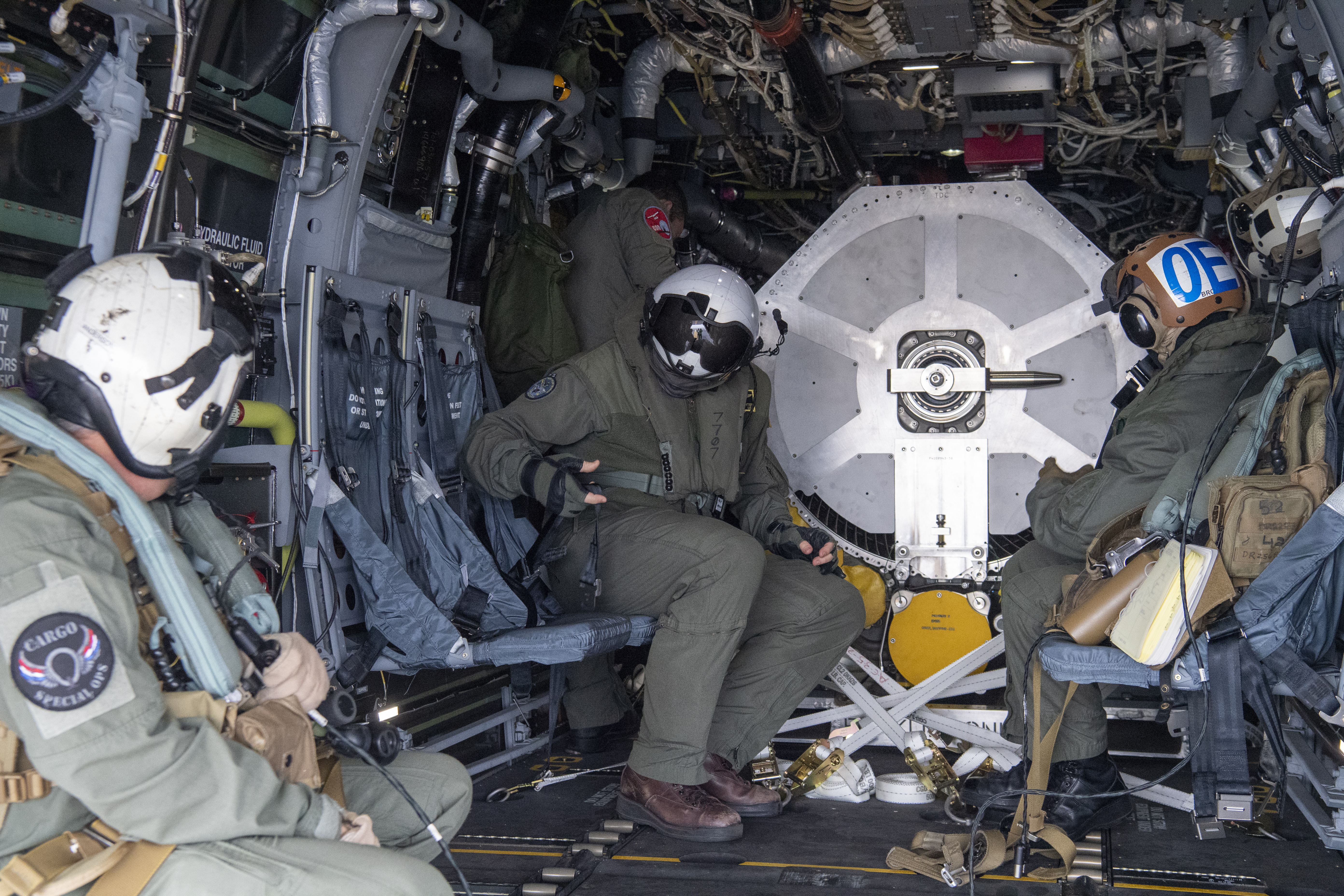 Sailors with Fleet Logistics Multi-Mission Squadron (VRM) 30 prepare for takeoff inside of a CMV-22B Osprey carrying an F-35C engine module on the flight deck of Nimitz-class nuclear aircraft carrier USS Carl Vinson (CVN 70)