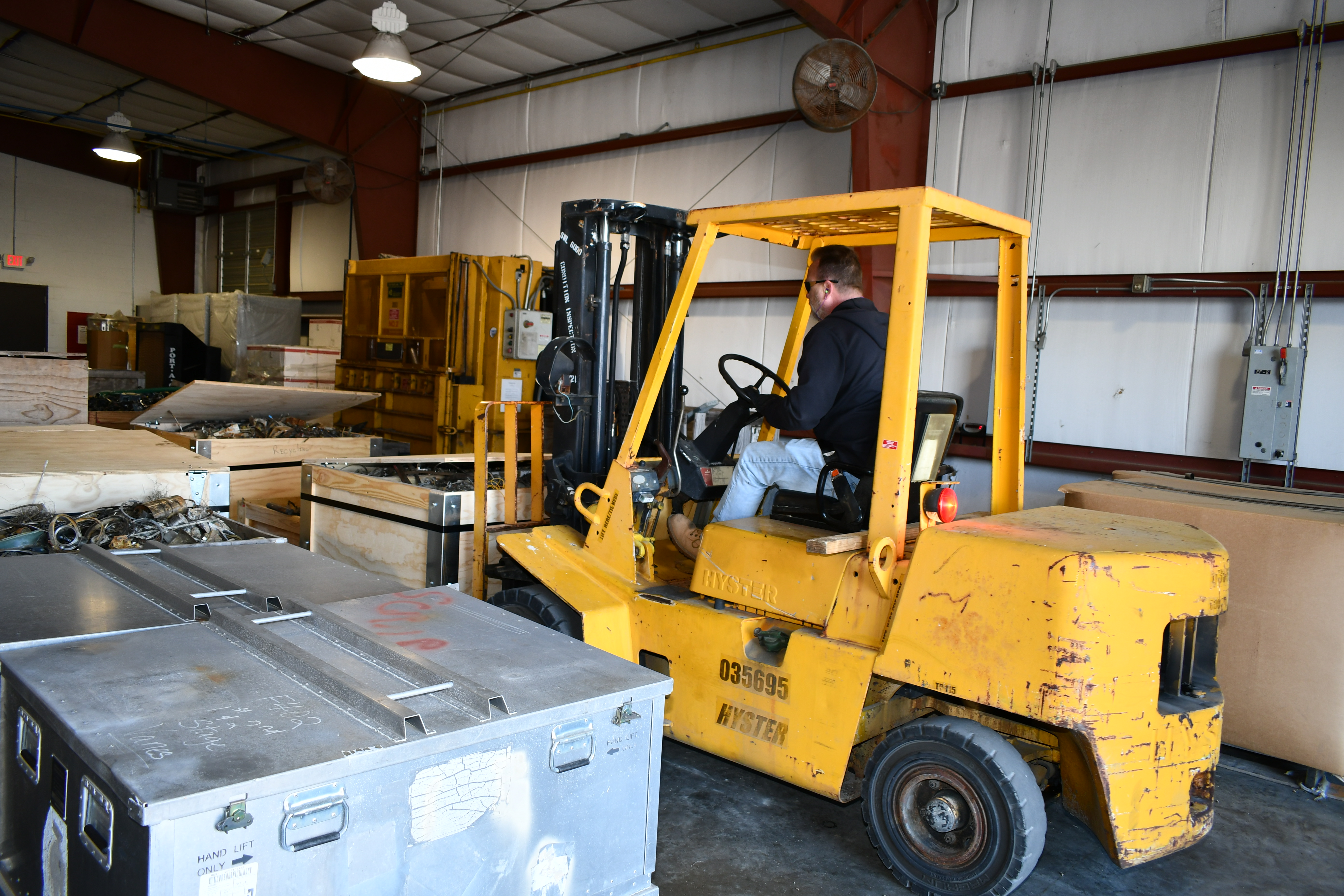 Forklift removes parts from warehouse
