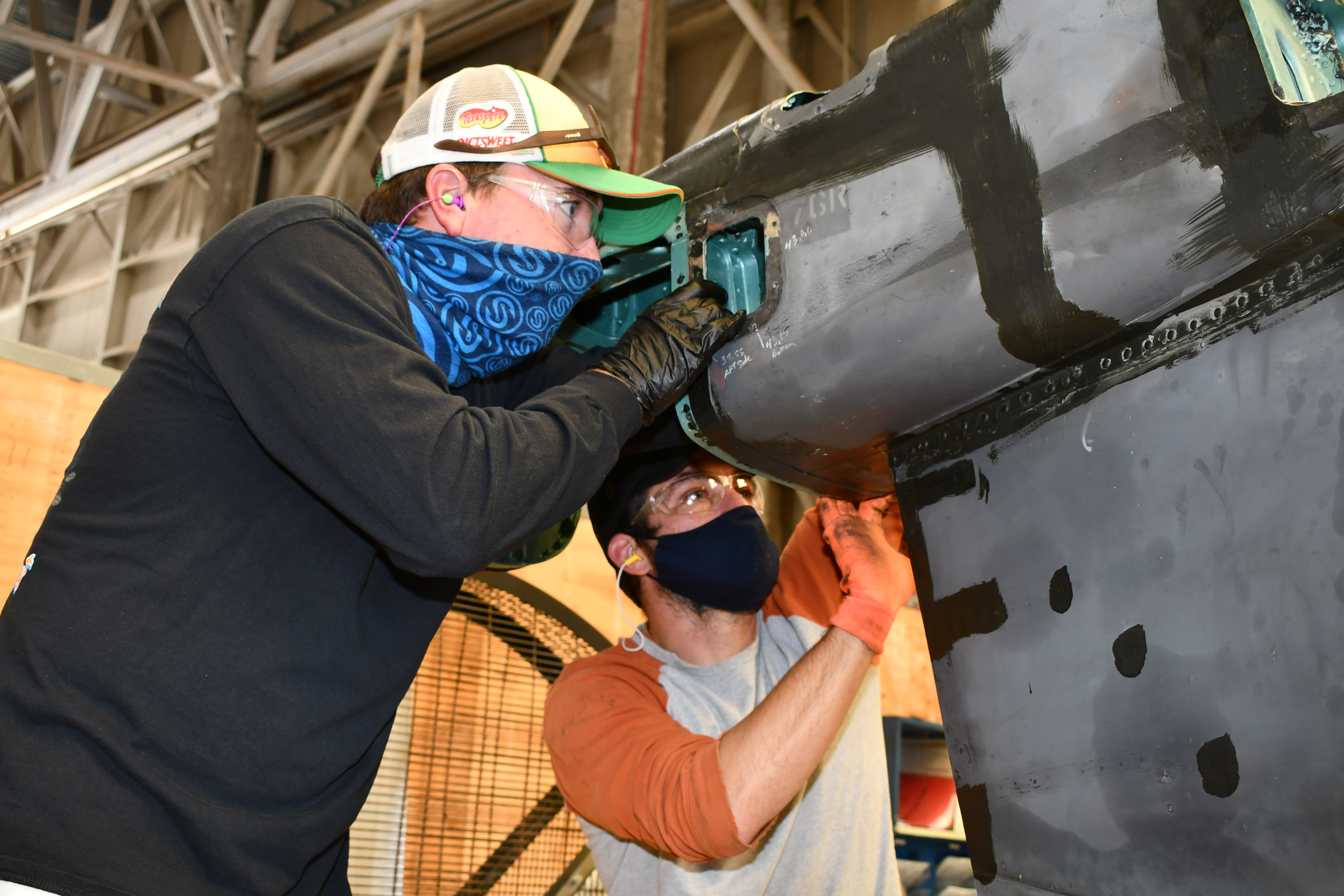 Artisans replace panels on Harrier