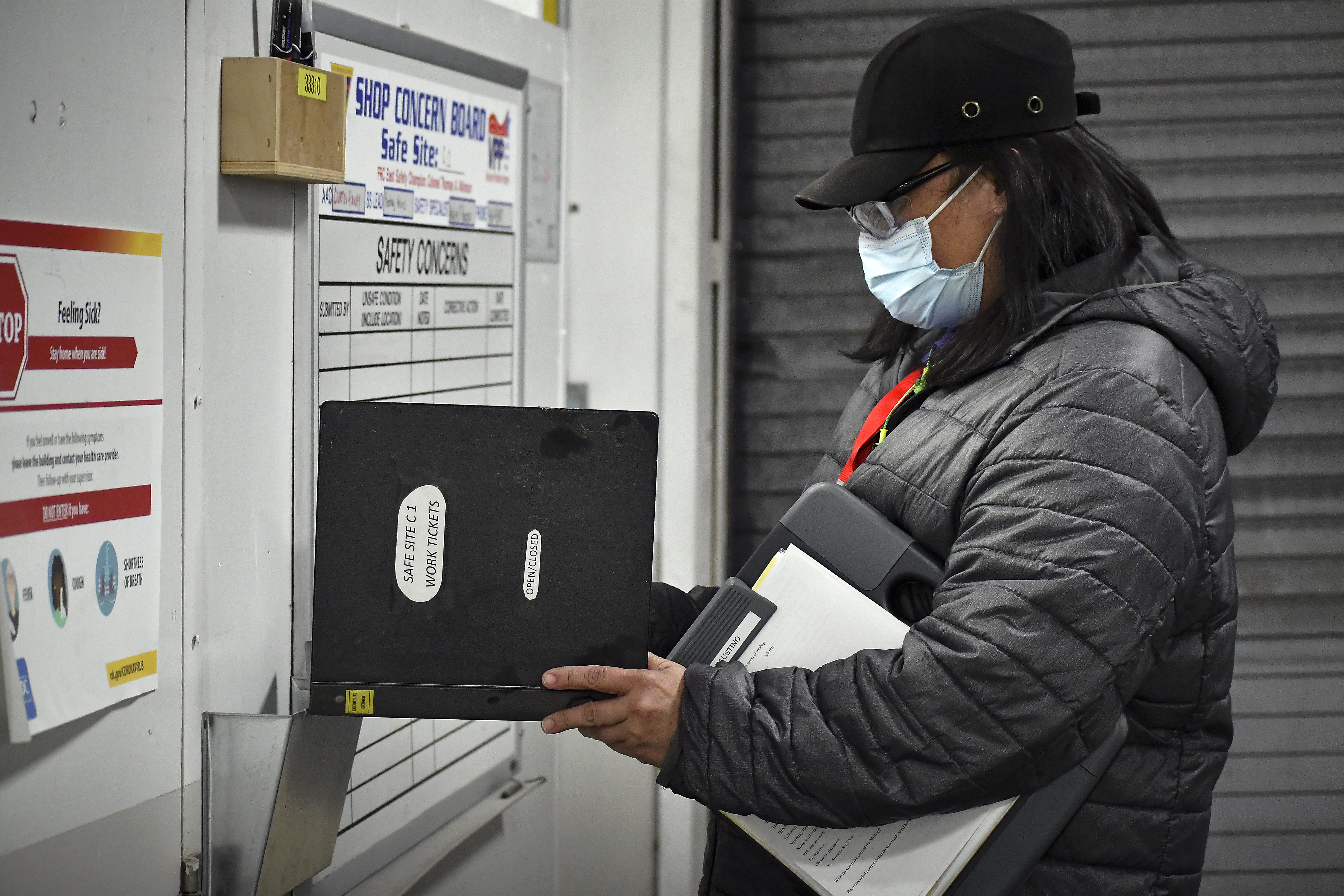 Aquiles Faustino, a safety specialist at Fleet Readiness Center East (FRCE), conducts an inspection of a safe site board. FRCE closed out calendar year 2021 with the lowest number of Occupational Safety and Health Administration (OSHA) recordable mishaps in the depot’s history.