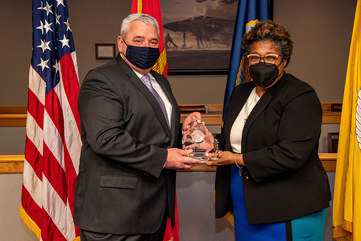 Deputy Assistant Secretary of Defense for Product Support Lisa P. Smith (right) presents Byrd with the 2021 Office of the Secretary of Defense for Acquisition and Sustainment PSM of the Year (Major Defense Acquisition Program, Acquisition Category 1) award. 