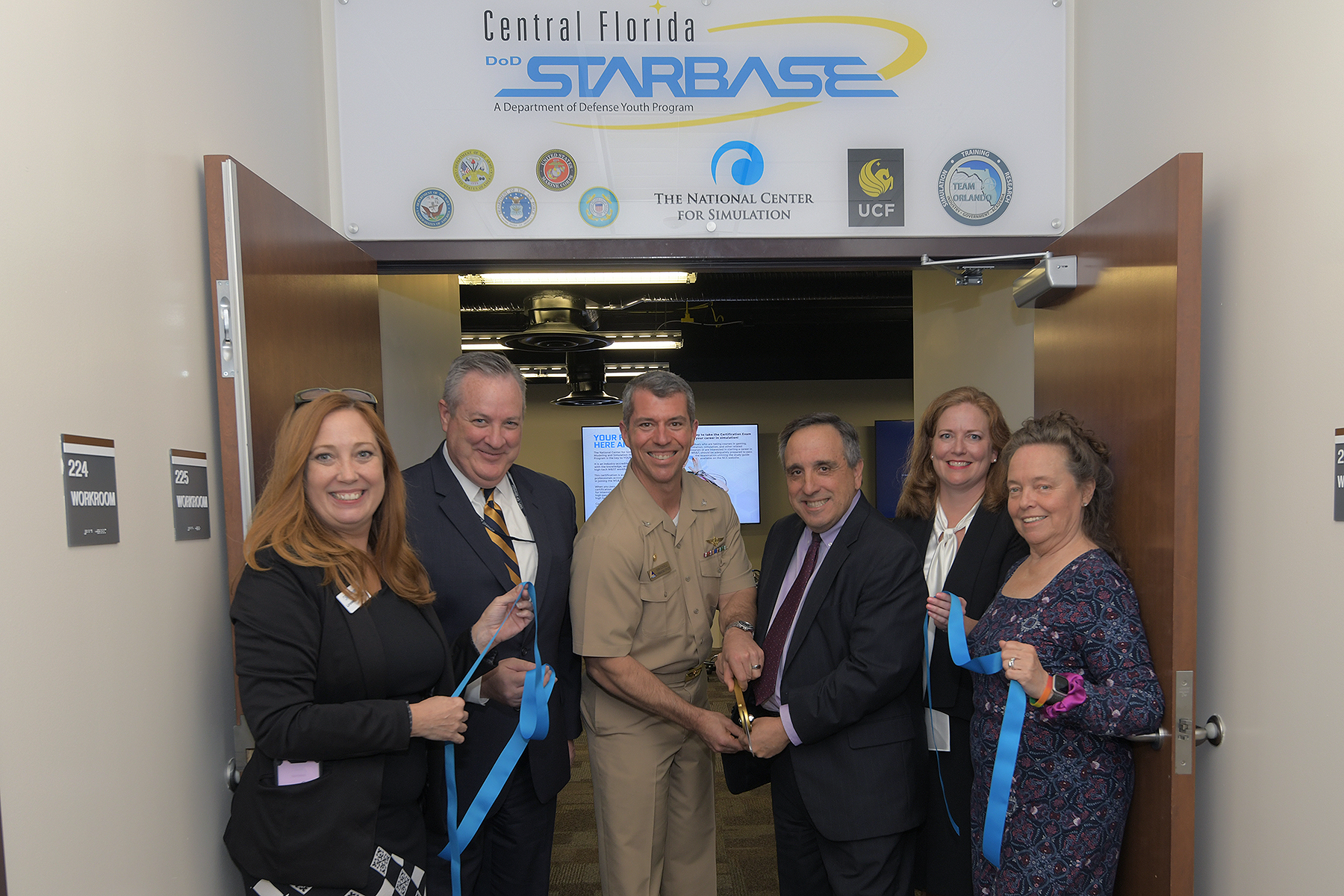 Ribbon Cutting under Central Florida STARBASE sign