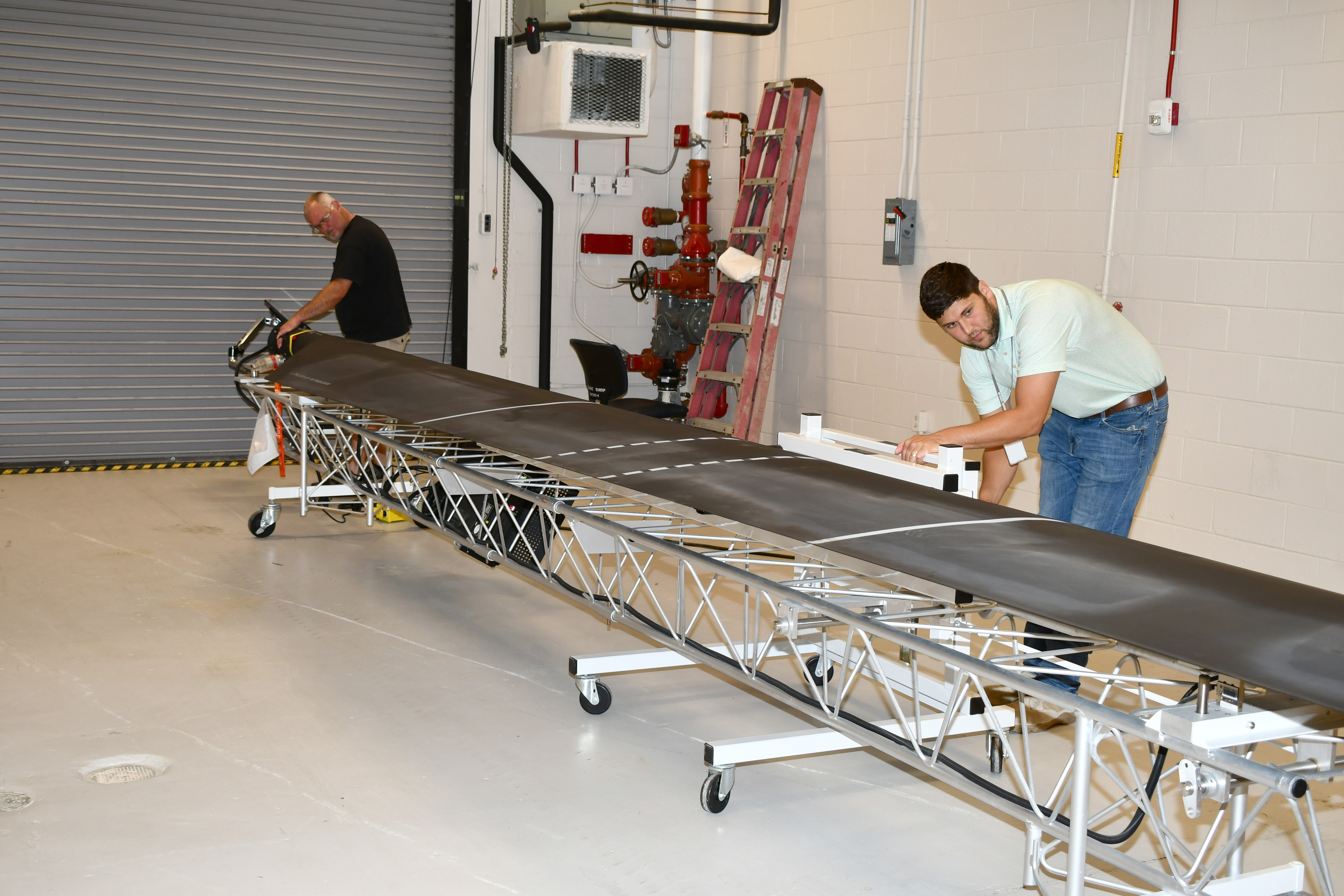 Workers set up blade balancing system