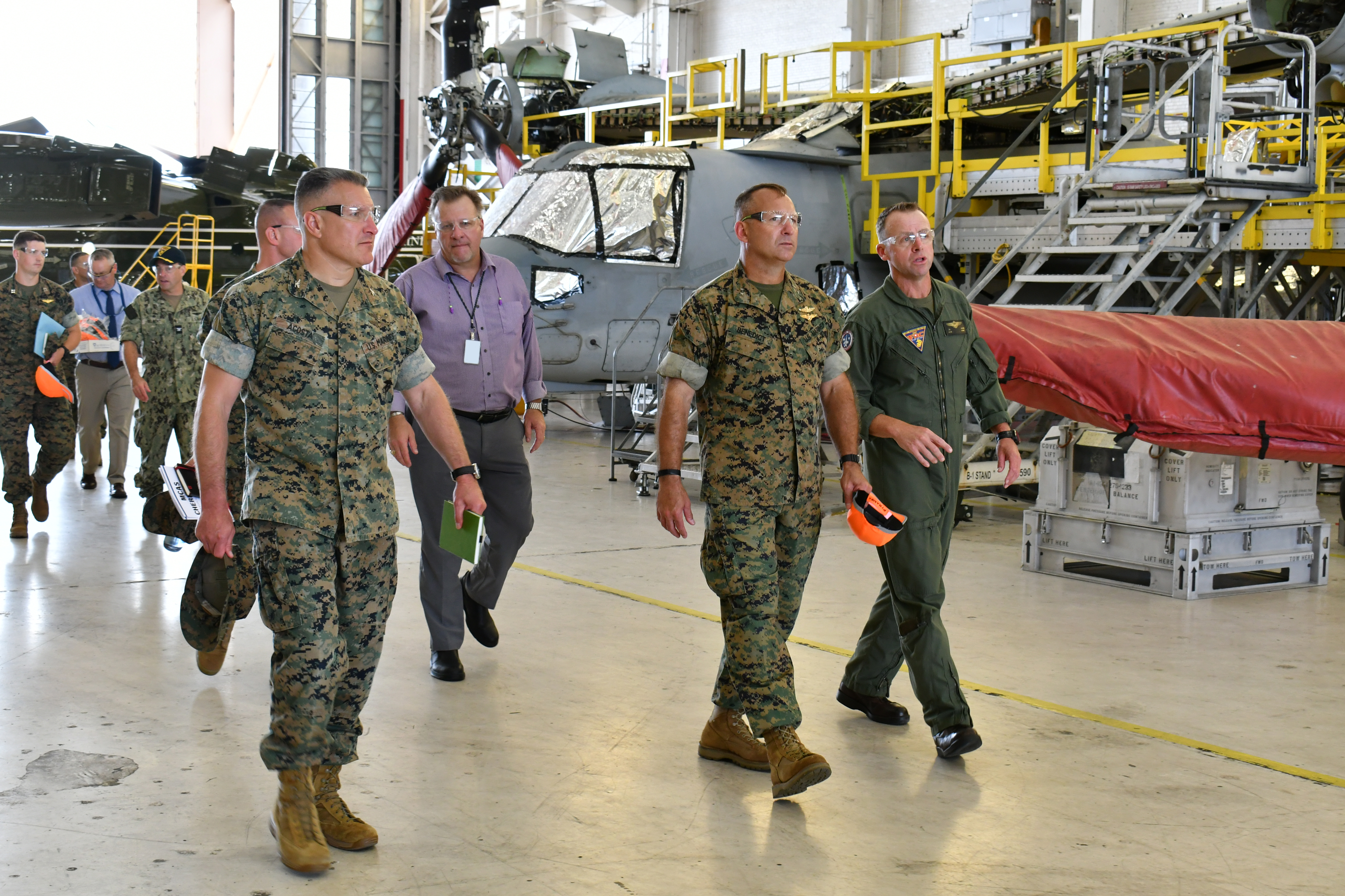 Fleet Readiness Center East (FRCE) Executive Officer Lt. Col. Jason Raper (right) discusses MV-22 overhaul operations with Maj. Gen. Scott F. Benedict, commanding general of 2nd Marine Aircraft Wing (MAW), during an Aug. 30 tour of the depot by 2nd MAW leadership.