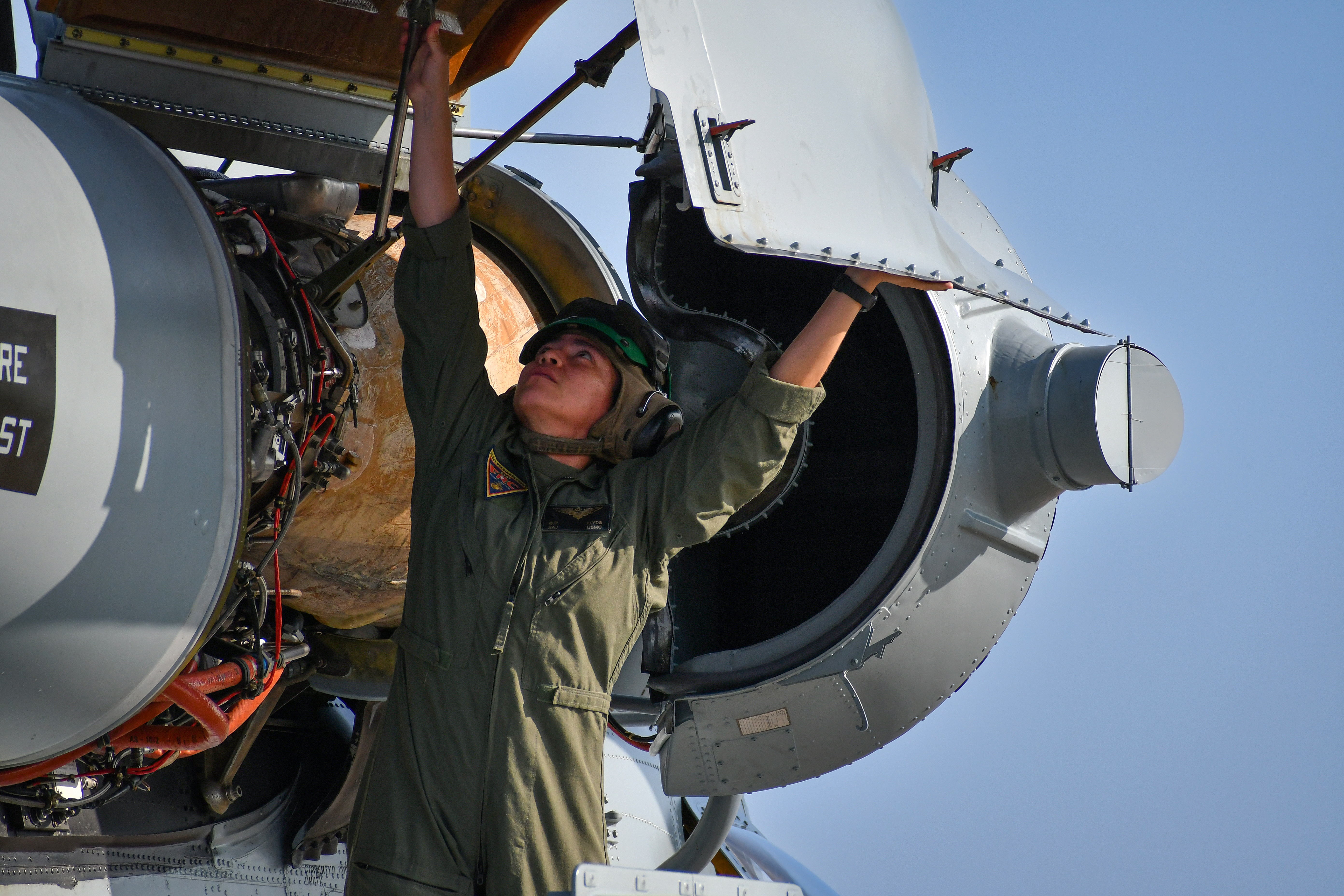 Maj. Brittany Fayos, Military Aircraft Production Deputy Director and CH/MH-53 pilot at Fleet Readiness Center East (FRCE), conducts a functional check flight inspection while preparing to deliver a recently overhauled CH-53 Sea Stallion helicopter to the Fleet. FRCE ensures warfighters throughout the Navy and Marine Corps are equipped with combat-ready aircraft. 