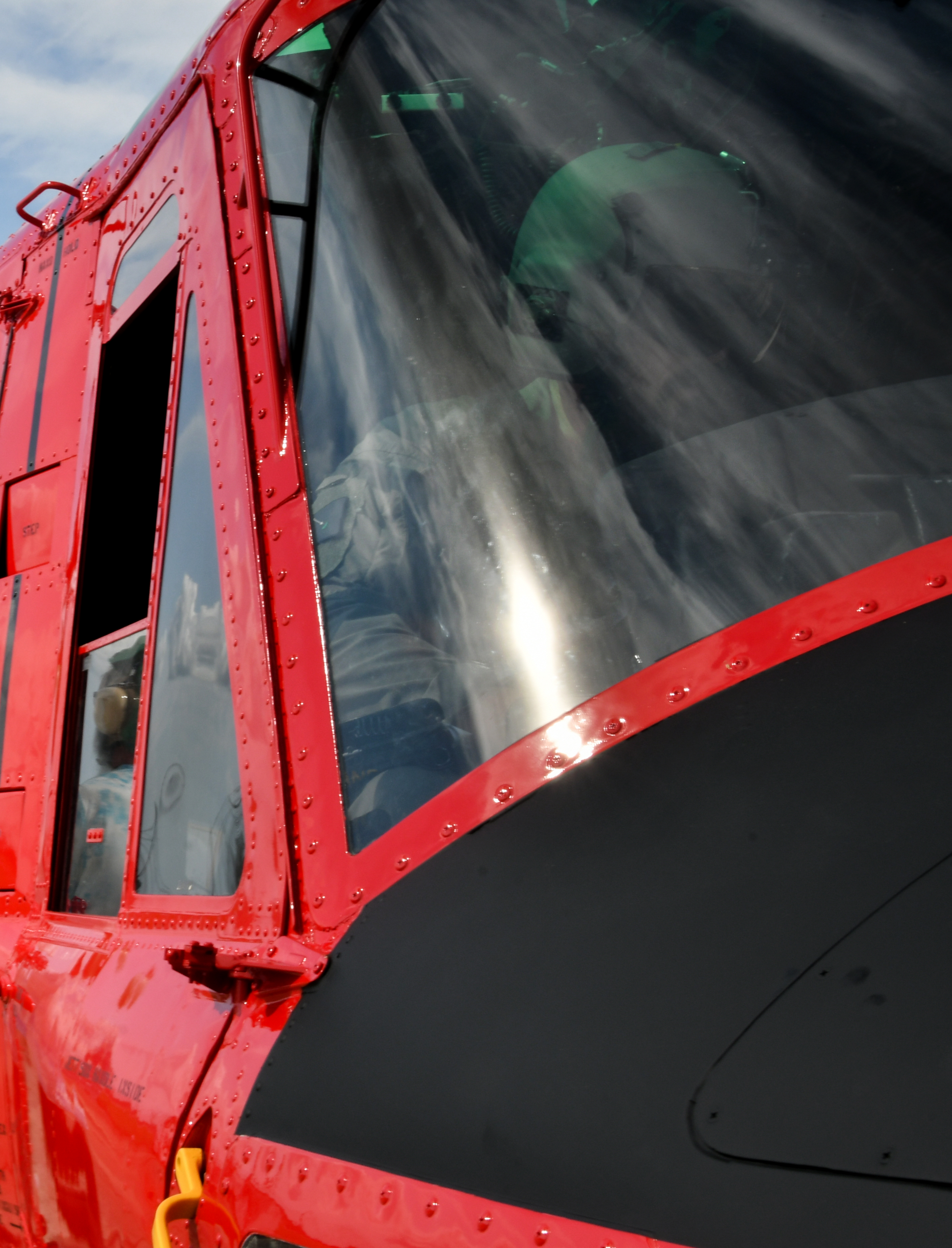Pilot flies UH-1N helicopter for functional check flight
