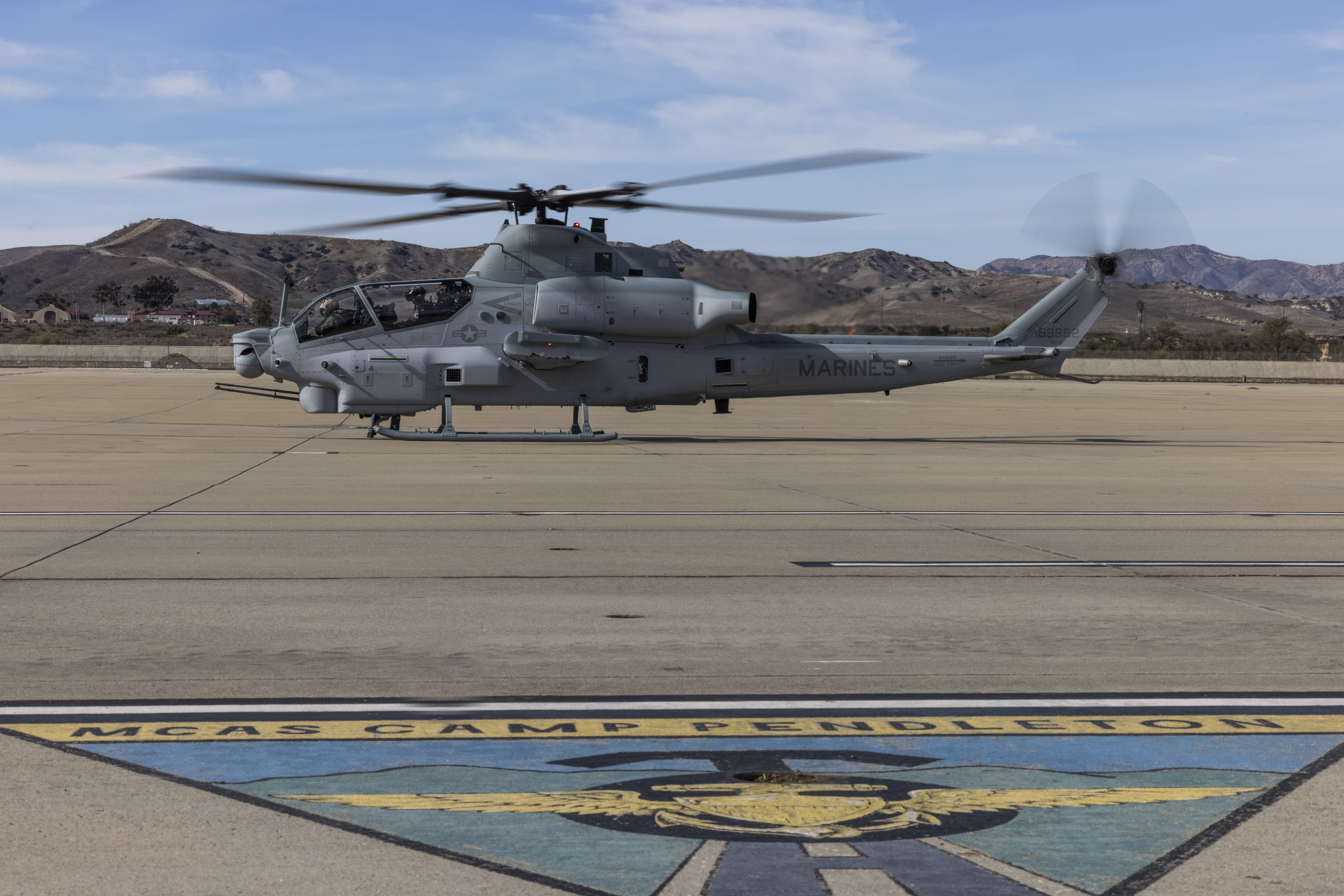 U.S. Marine Corps Col. Nathan “MOG” Marvel, commanding officer of Marine Aircraft Group (MAG) 39, 3rd Marine Aircraft Wing (MAW), lands the final AH-1Z Viper produced for the Marine Corps on Marine Corps Air Station Camp Pendleton, California, Nov. 4, 2022