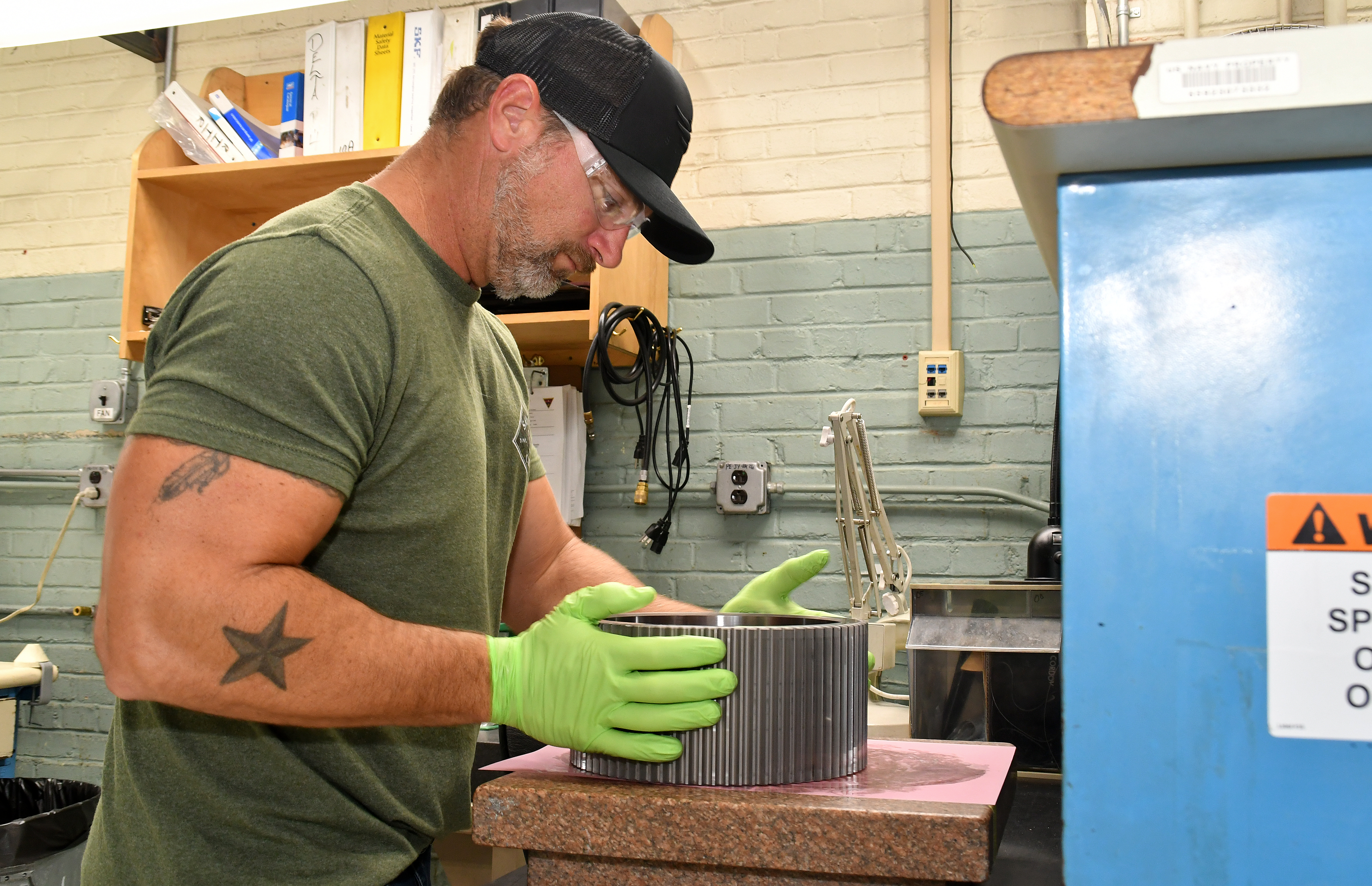 Fleet Readiness Center East (FRCE) Bearing Shop work leader Justin Parrish prepares a bearing for cleaning. FRCE’s Bearing Shop refurbishes hundreds of bearings each week, turning out several thousand each month. The shop works with nearly 5,000 different part numbers ranging from bearings used on CH-53 helicopters to those used in military hovercraft variants. 