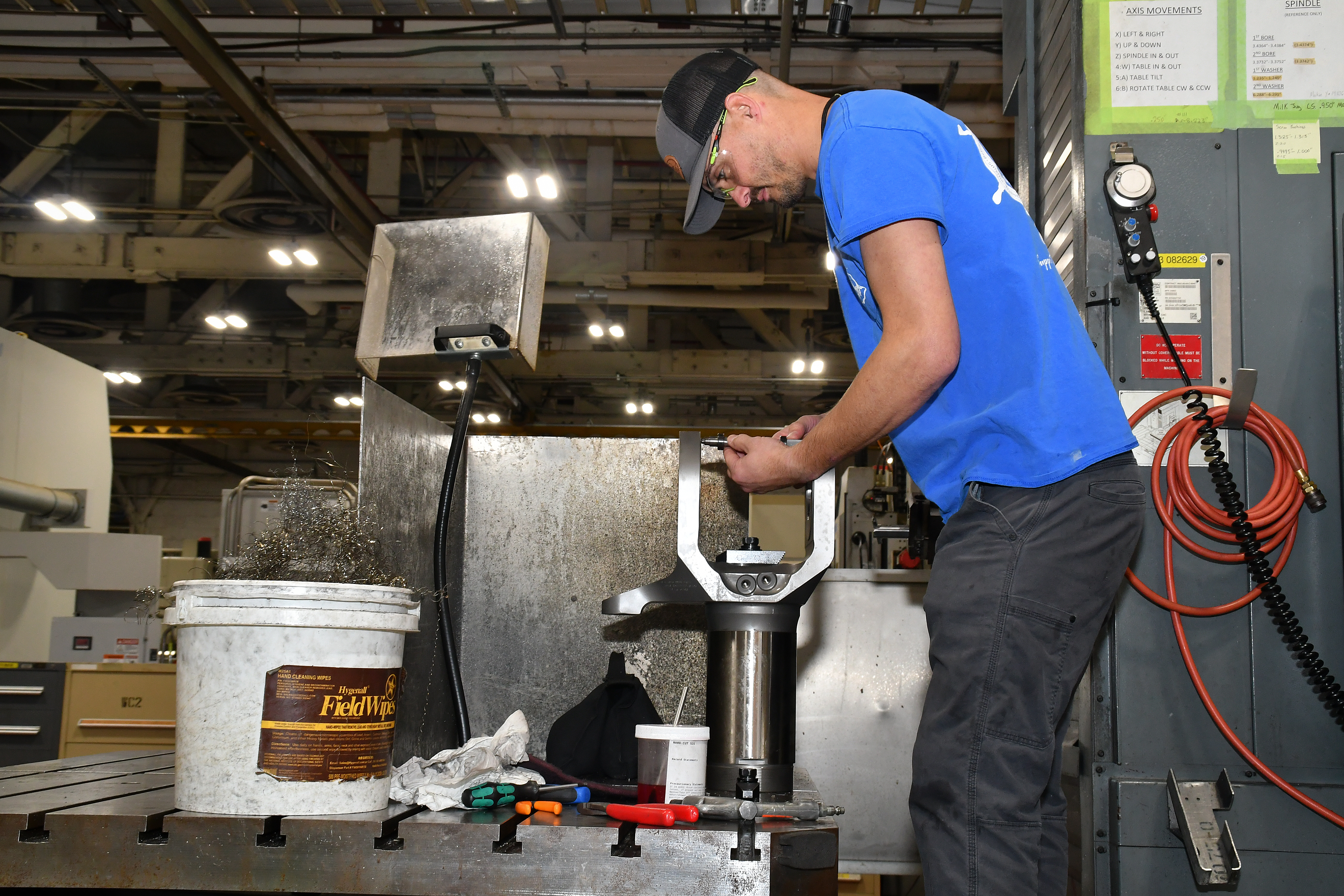 Joshua Morris, a machinist apprentice at Fleet Readiness Center East’s Repair Machine Shop, measures spindle assembly bushings. The Repair Machine Shop recently wrapped up a successful process improvement project which reduced the turnaround time for parts and components coming out of the shop and enhanced the depot’s ability to deliver parts, components, and aircraft to the warfighter. 
