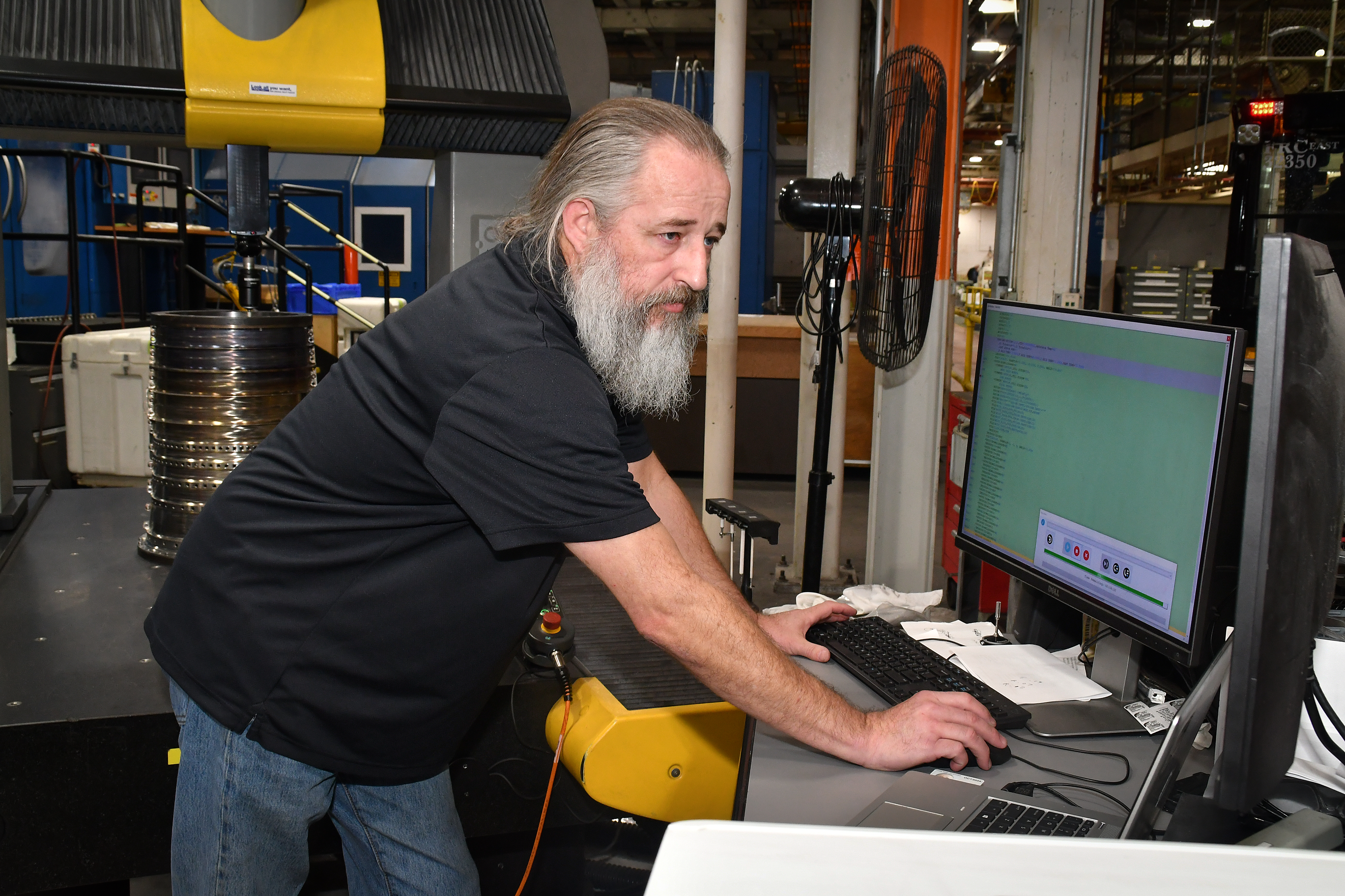 John Stafford, a machinist at Fleet Readiness Center East’s Repair Machine Shop, takes precise measurements on a T64 engine component. It is not uncommon for the machinists working in the shop to deal with tolerances as low as one ten thousandth of an inch. The Repair Machine Shop supports the depot’s aircraft production areas by reconditioning and refurbishing a vast array of parts and components. 
