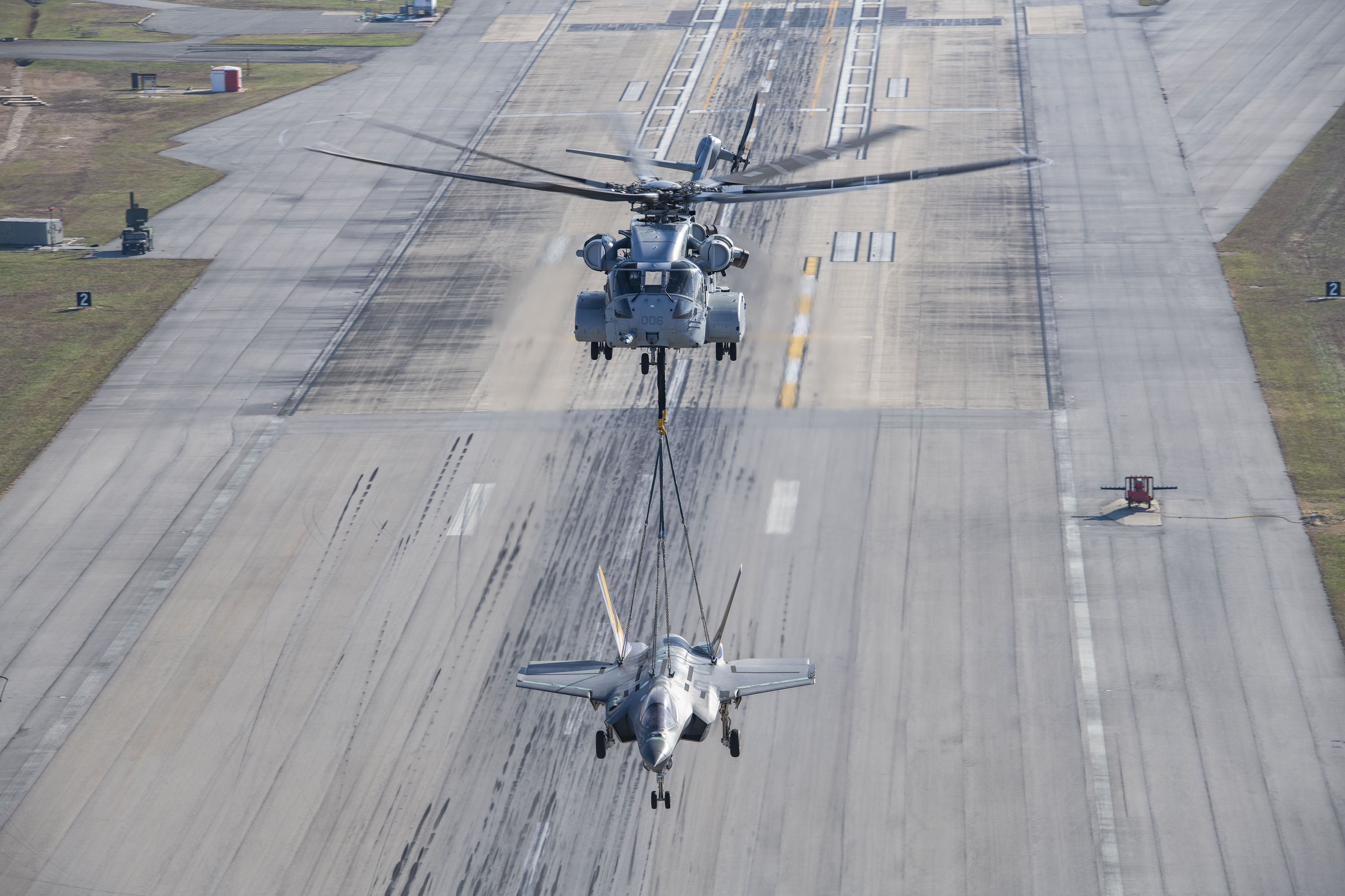 A non-flyable F-35C Lightning II airframe is flown as part of a CH-53K King Stallion external load certification lift Dec. 13, 2022, at Naval Air Station Patuxent River, Md. 