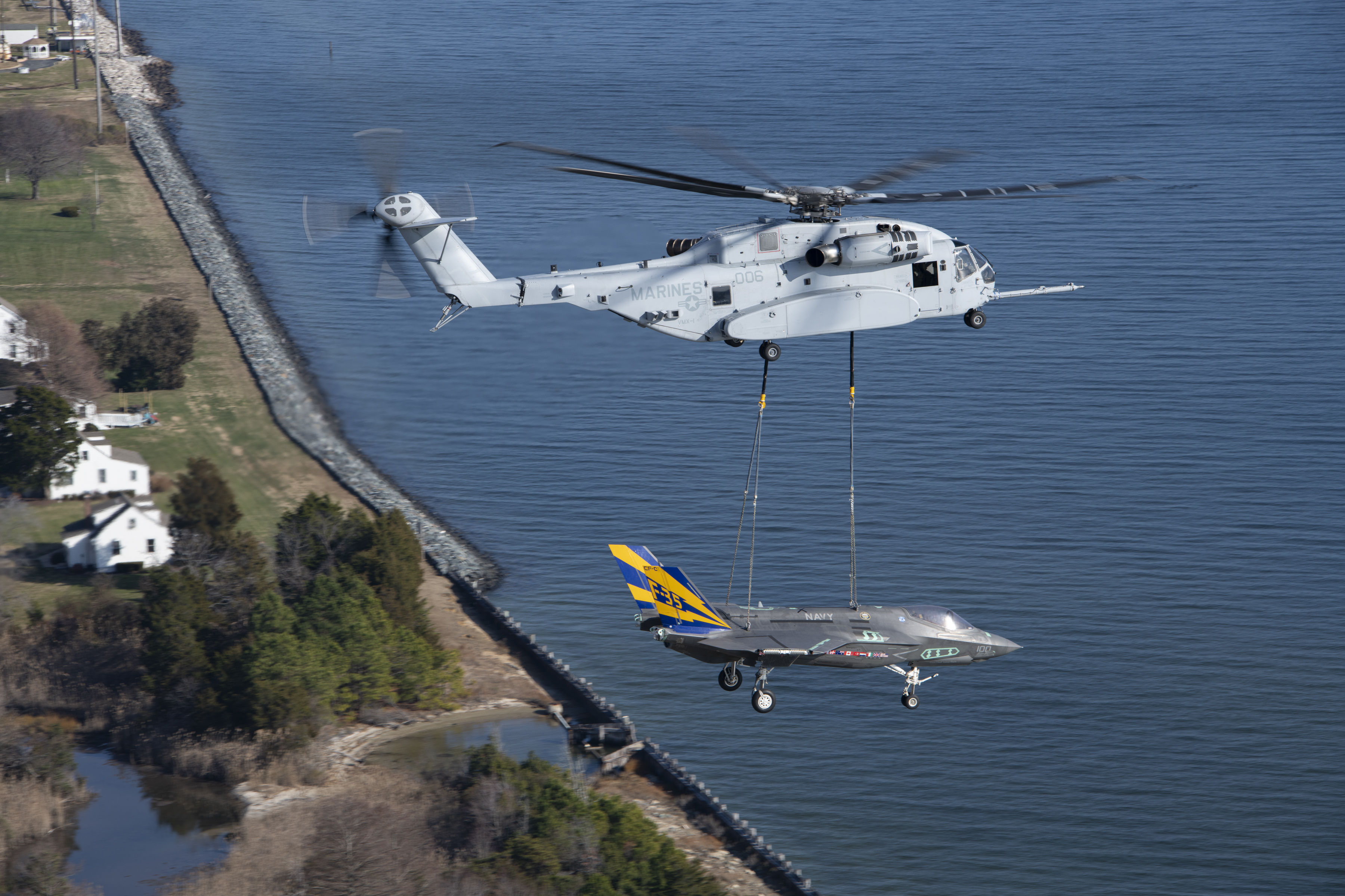 A non-flyable F-35C Lightning II airframe is flown as part of a CH-53K King Stallion external load certification lift Dec. 13, 2022, at Naval Air Station Patuxent River, Md.