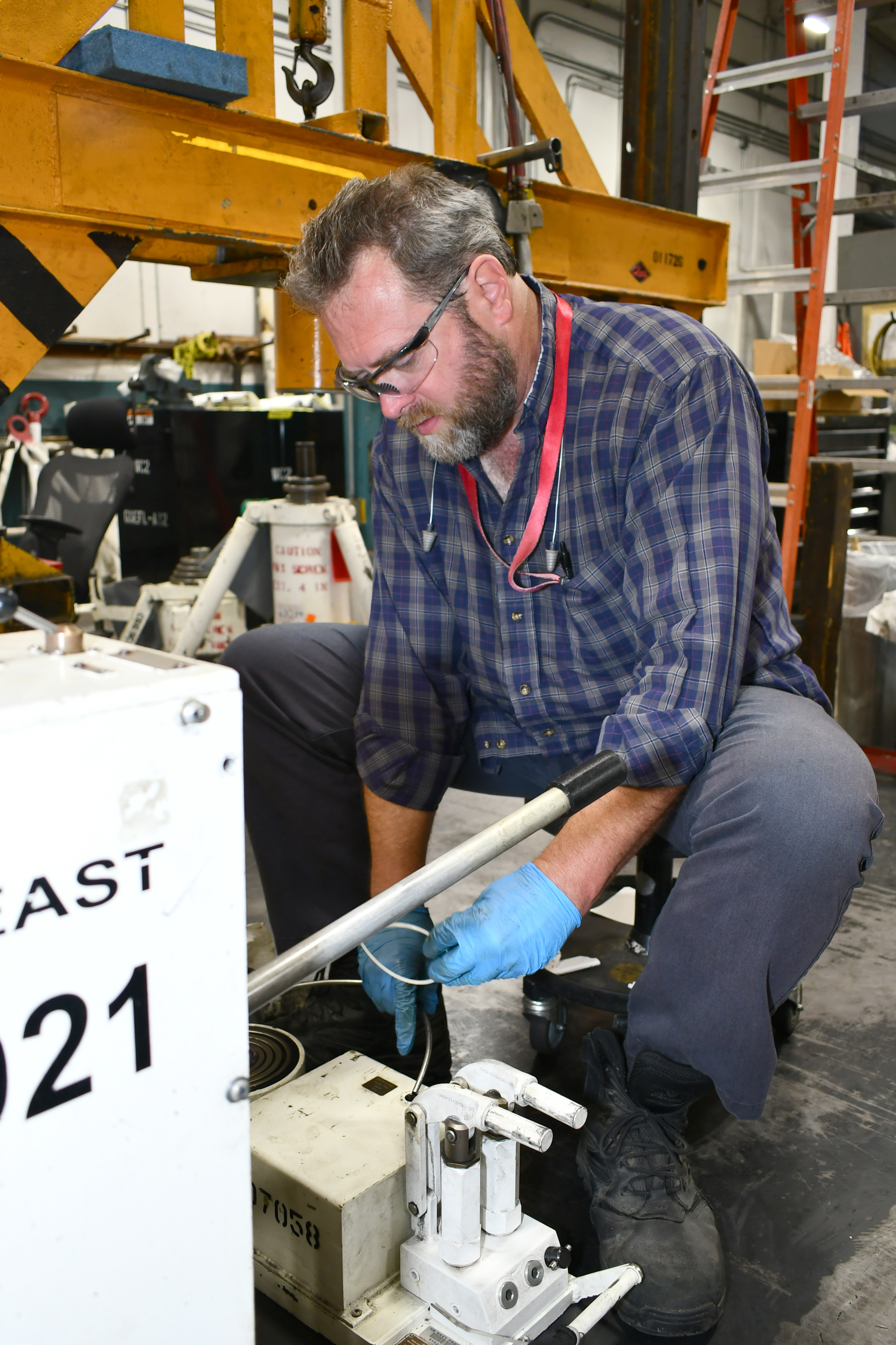 Ground support mechanic repairs equipment