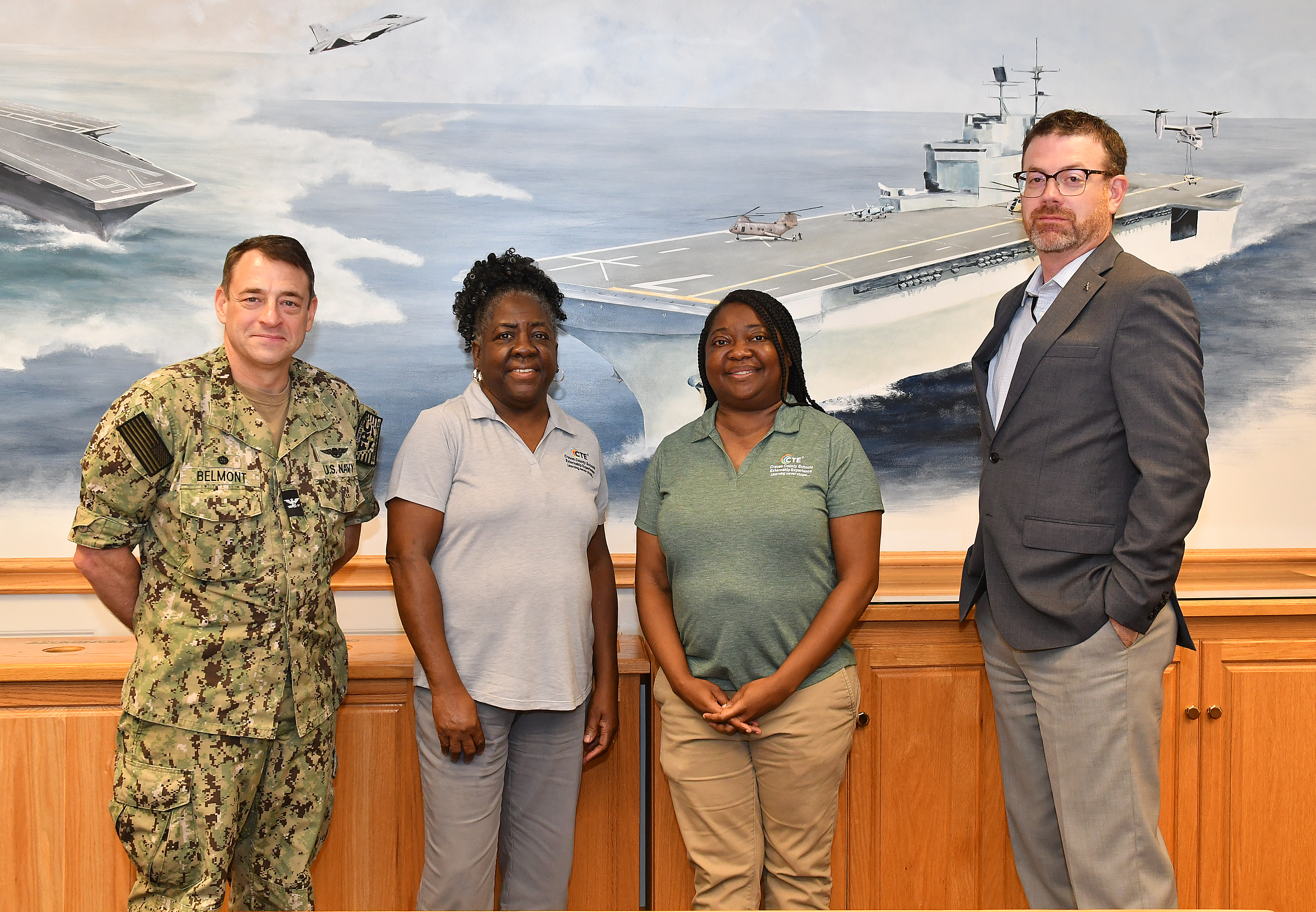 leet Readiness Center East (FRCE) leaders pose for a group photograph with local educators during an externship program FRCE hosted aimed at showcasing career opportunities to area students. 