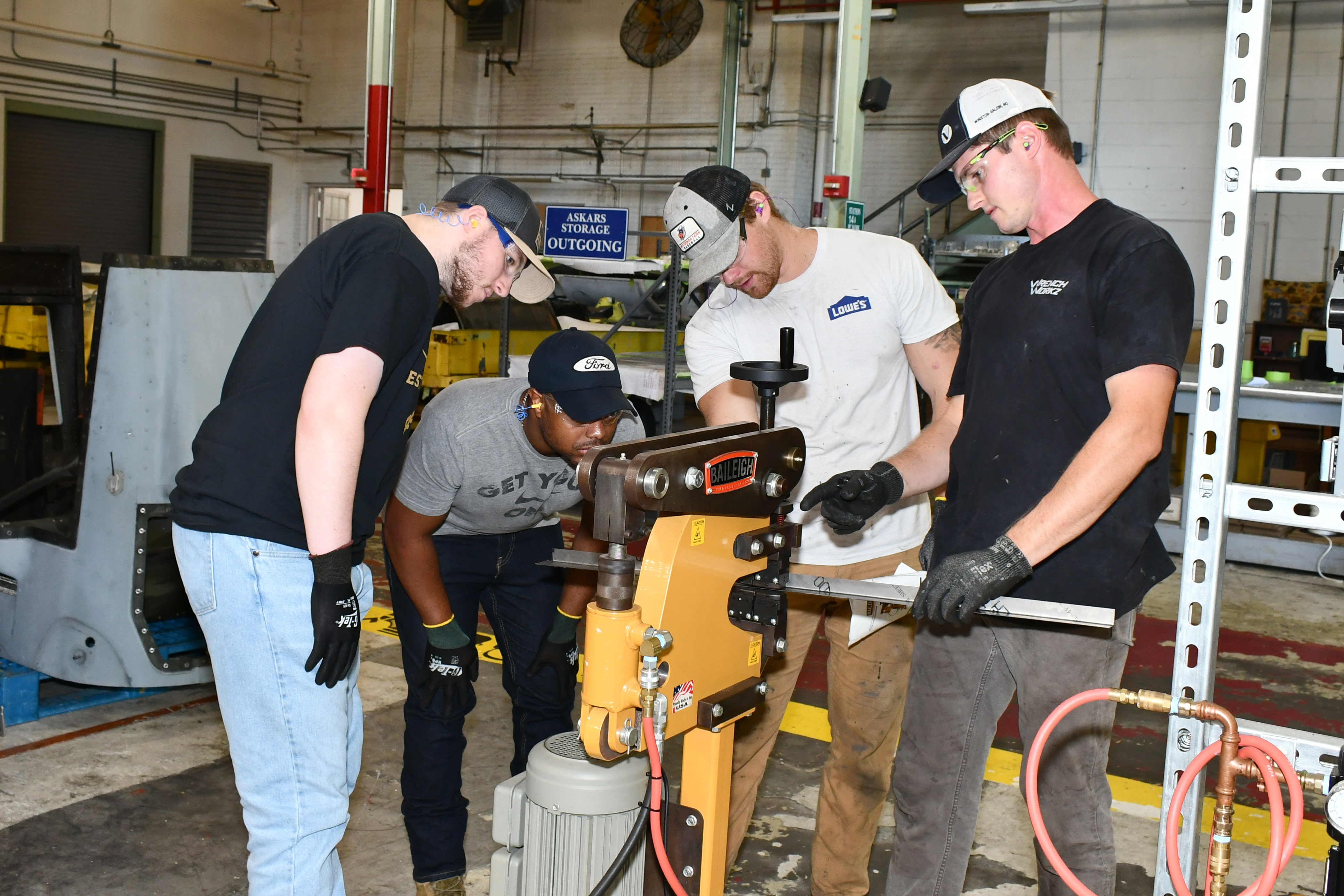 Artisans inspect equipment.