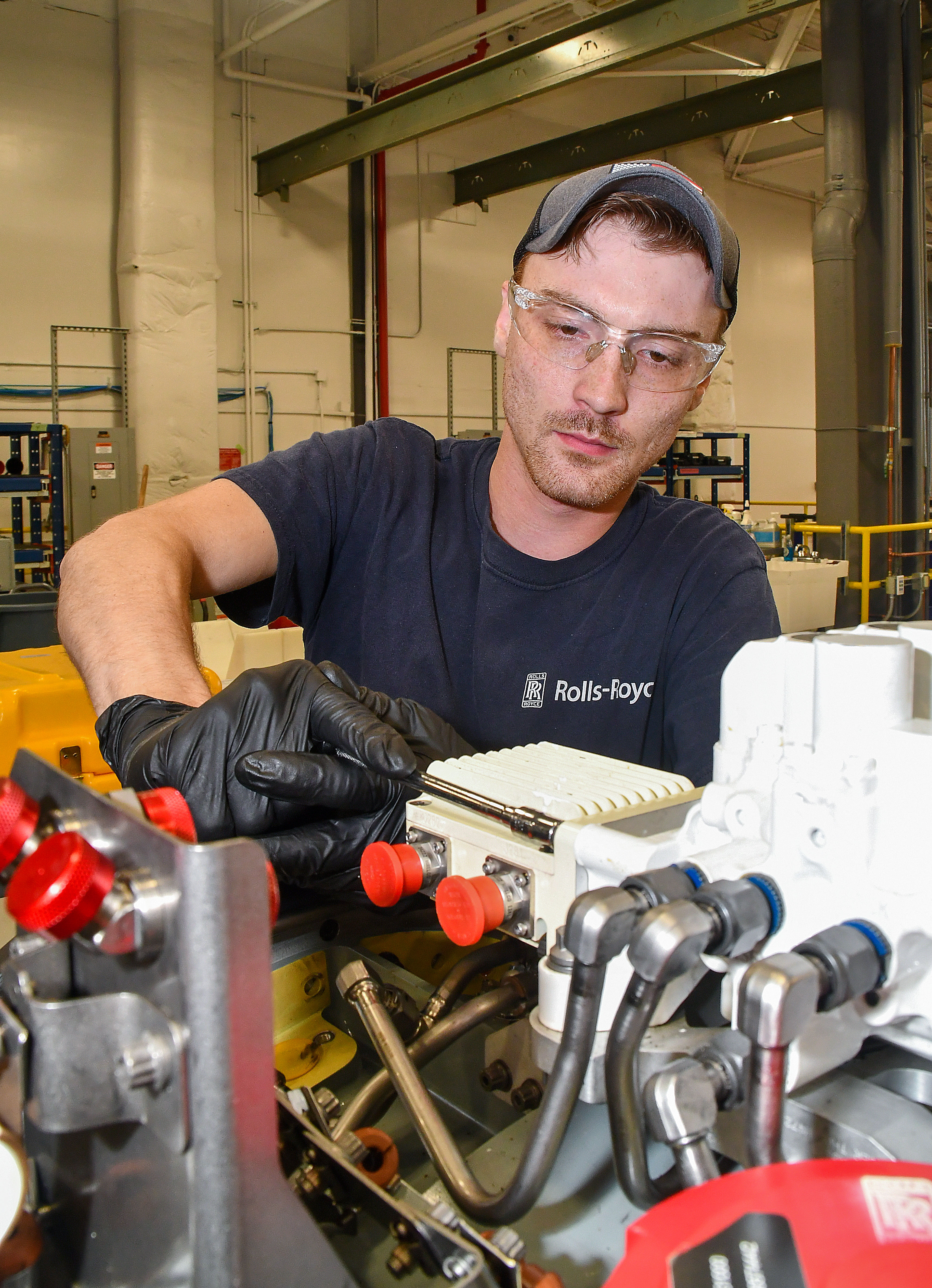 Dakota Martin, an aircraft engine mechanics at Fleet Readiness Center East (FRCE), begins disassembly of a lift fan clutch for the F-35B Lightning II aircraft. FRCE personnel became the first within the Department of Defense (DoD) to perform a successful assembly of this component outside of Rolls Royce’s LiftWorks facility in Indianapolis. 
