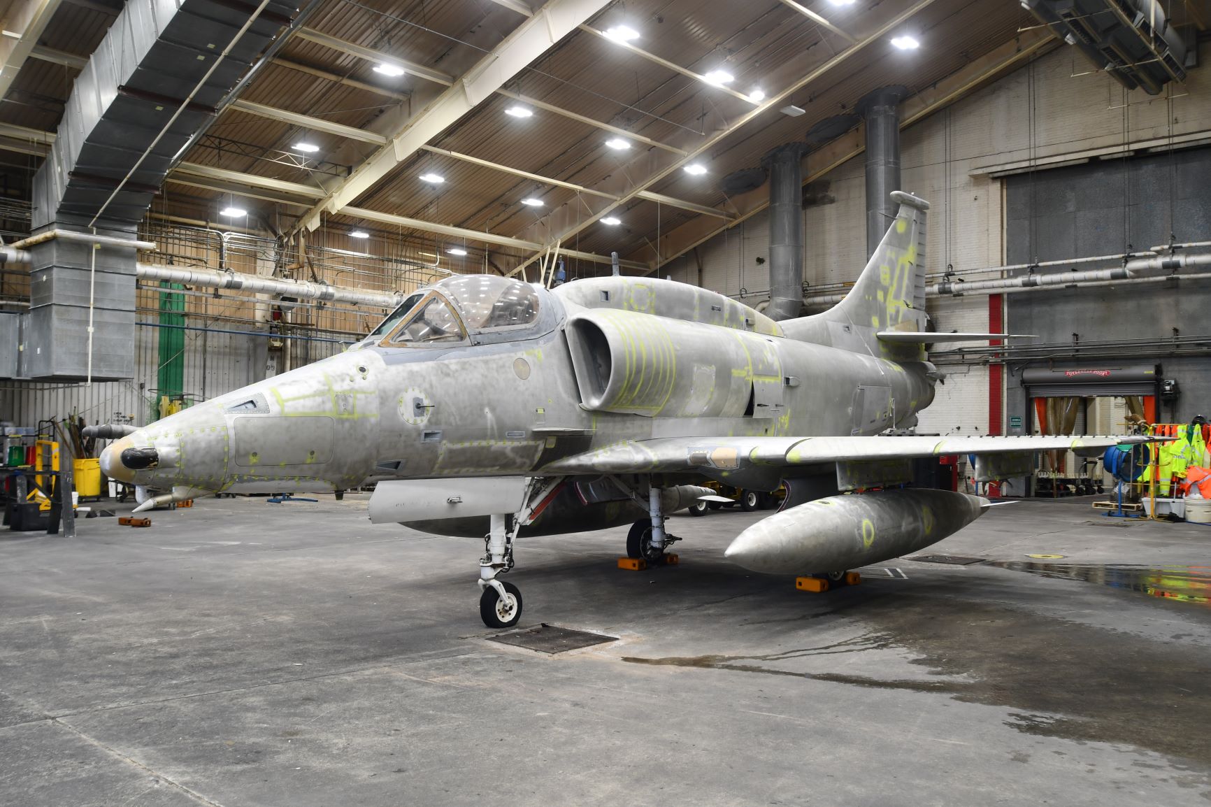 Gray-looking aircraft in a large building 