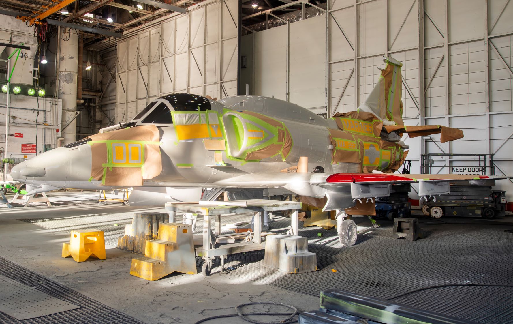 Side view of the aircraft with tape and stencils stuck to it 