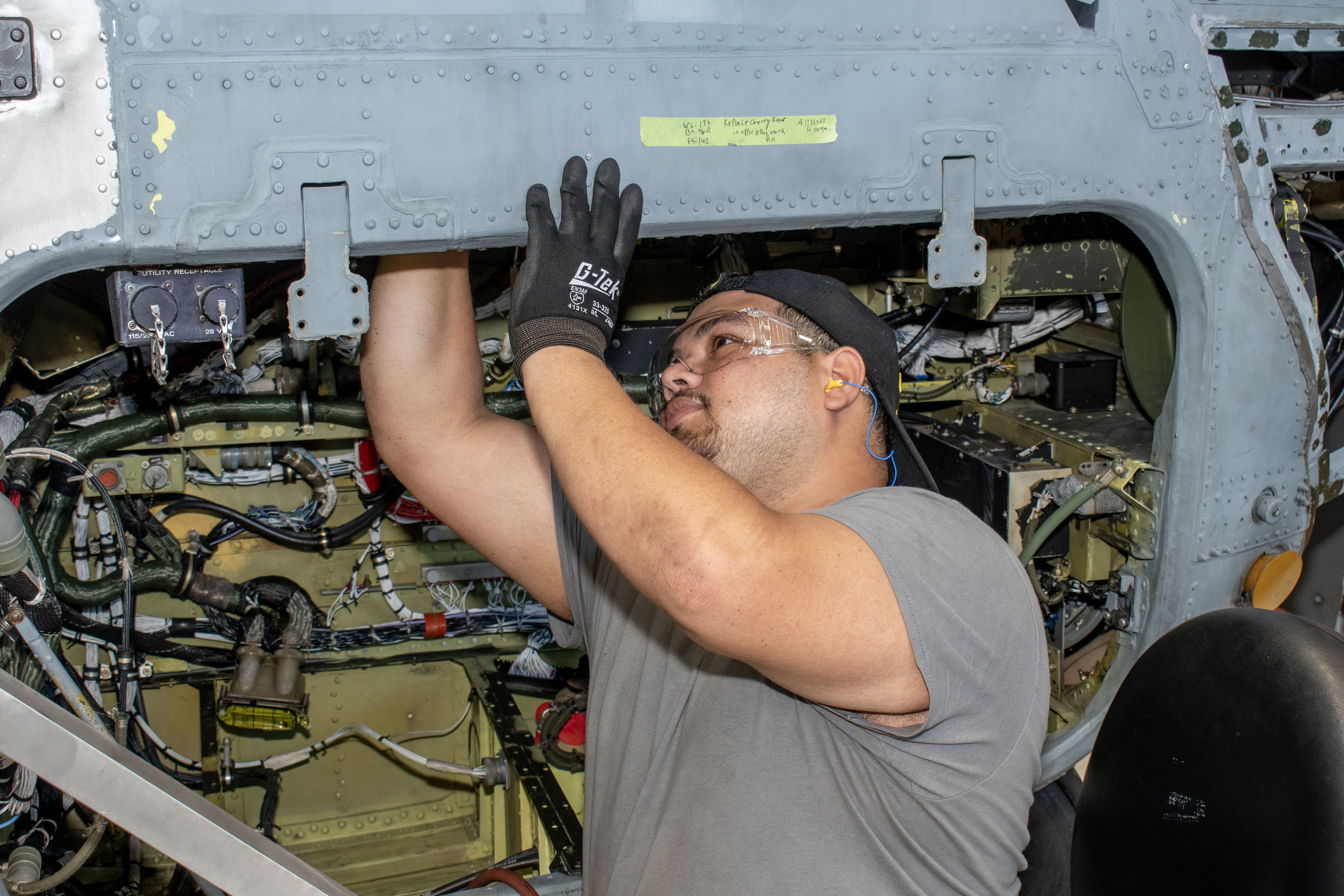 Man performing maintenance on aircraft
