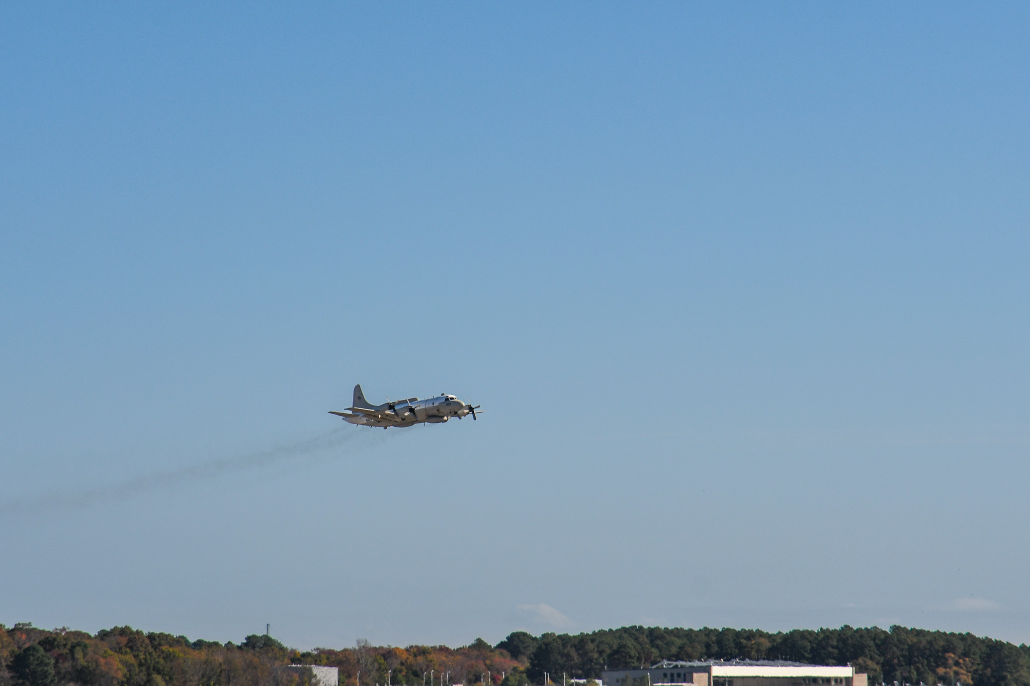 Airplane taking off in a blue sky