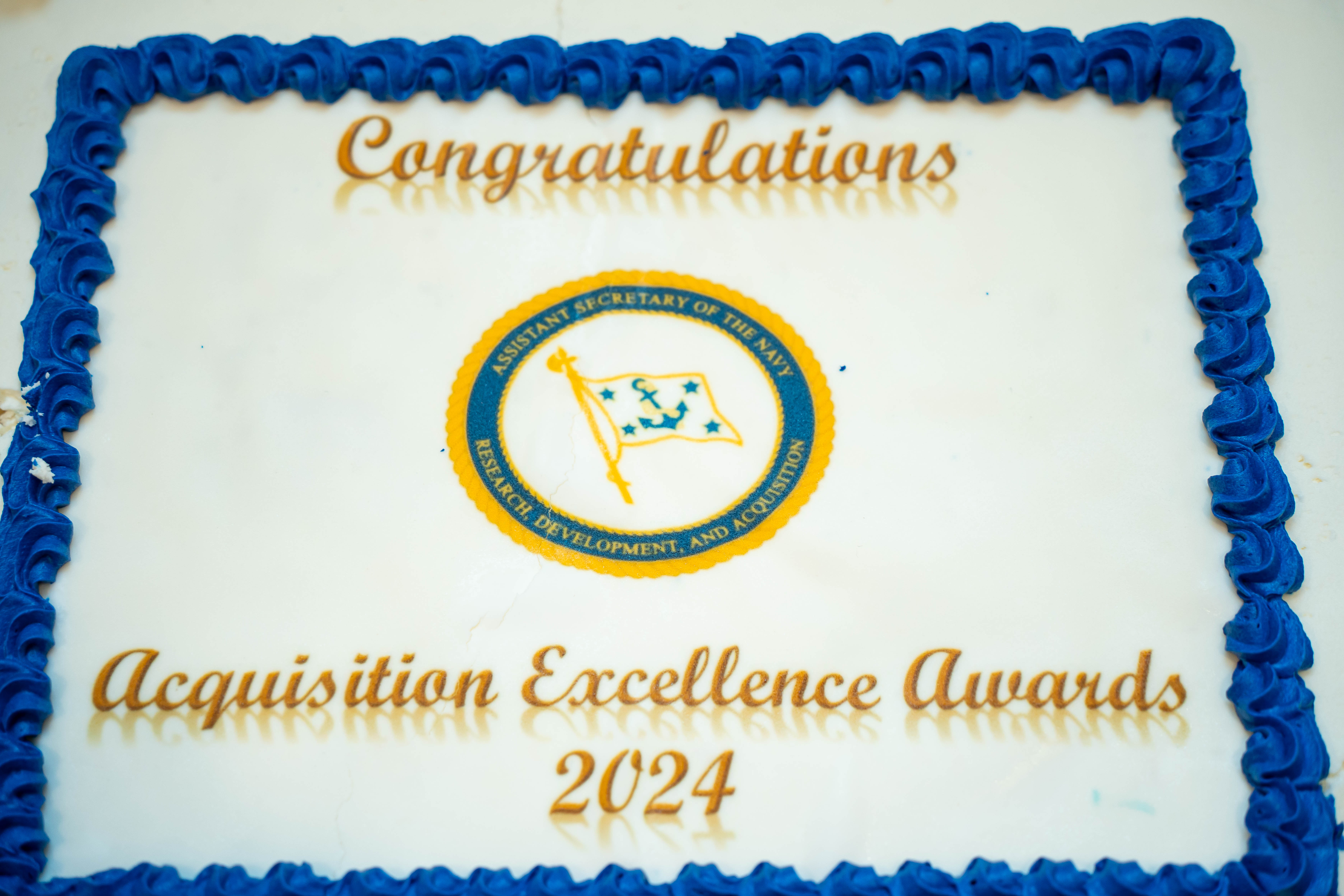 Picture of a cake that reads Congratulations Acquisition Excellence Awards 2024