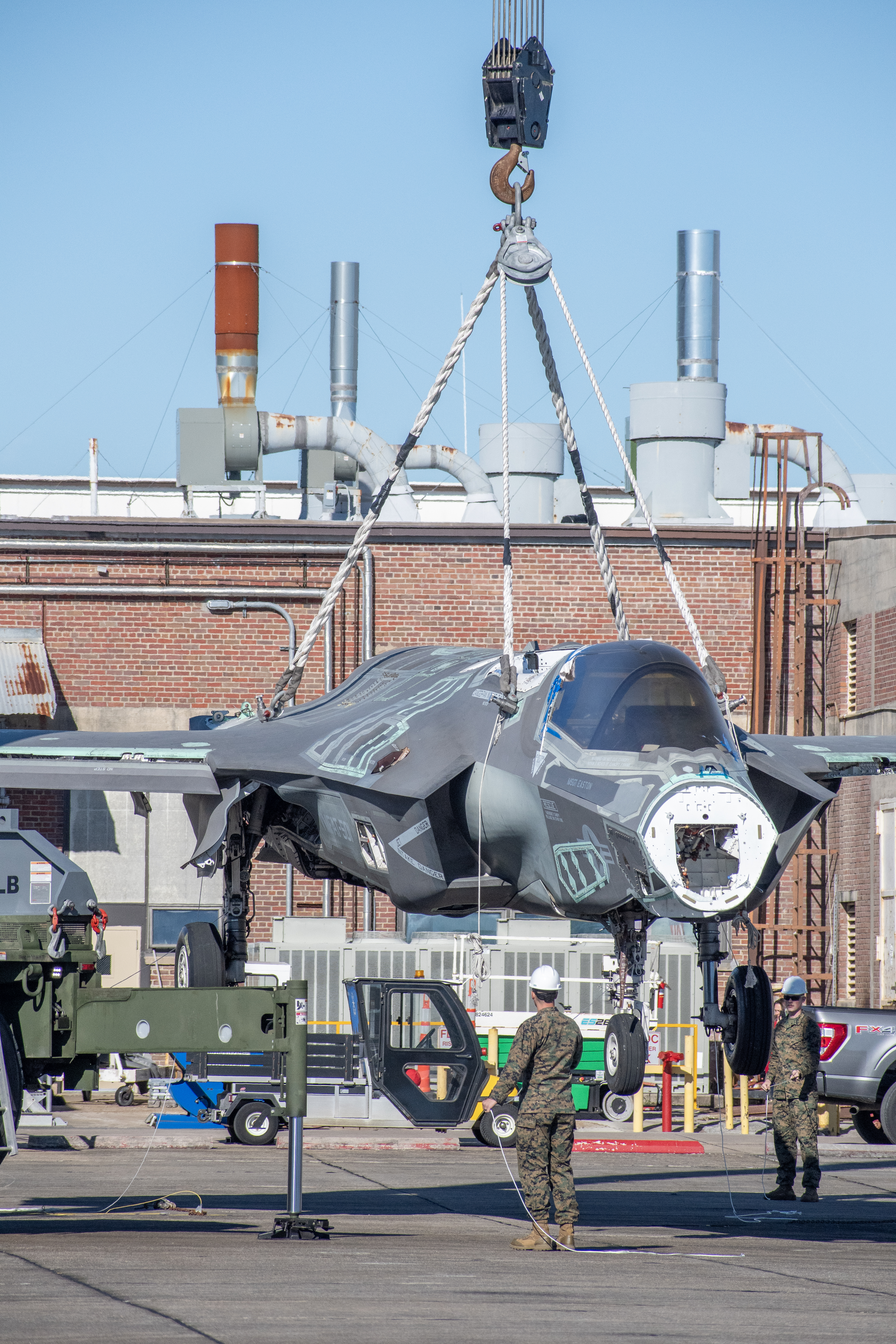 Marines use crane to lift decommissioned F-35 airframe