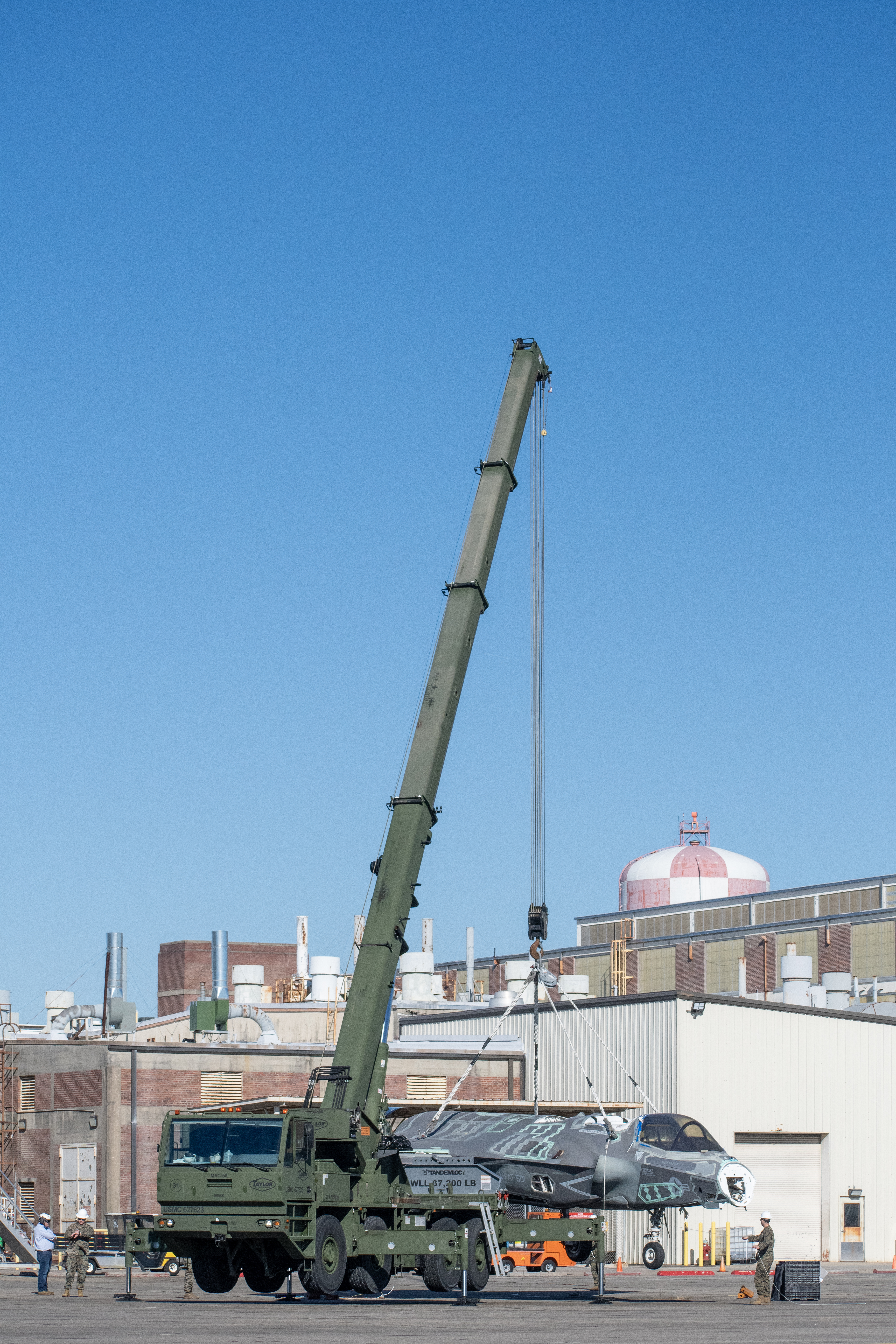 Marines use crane to lift decommissioned F-35 airframe